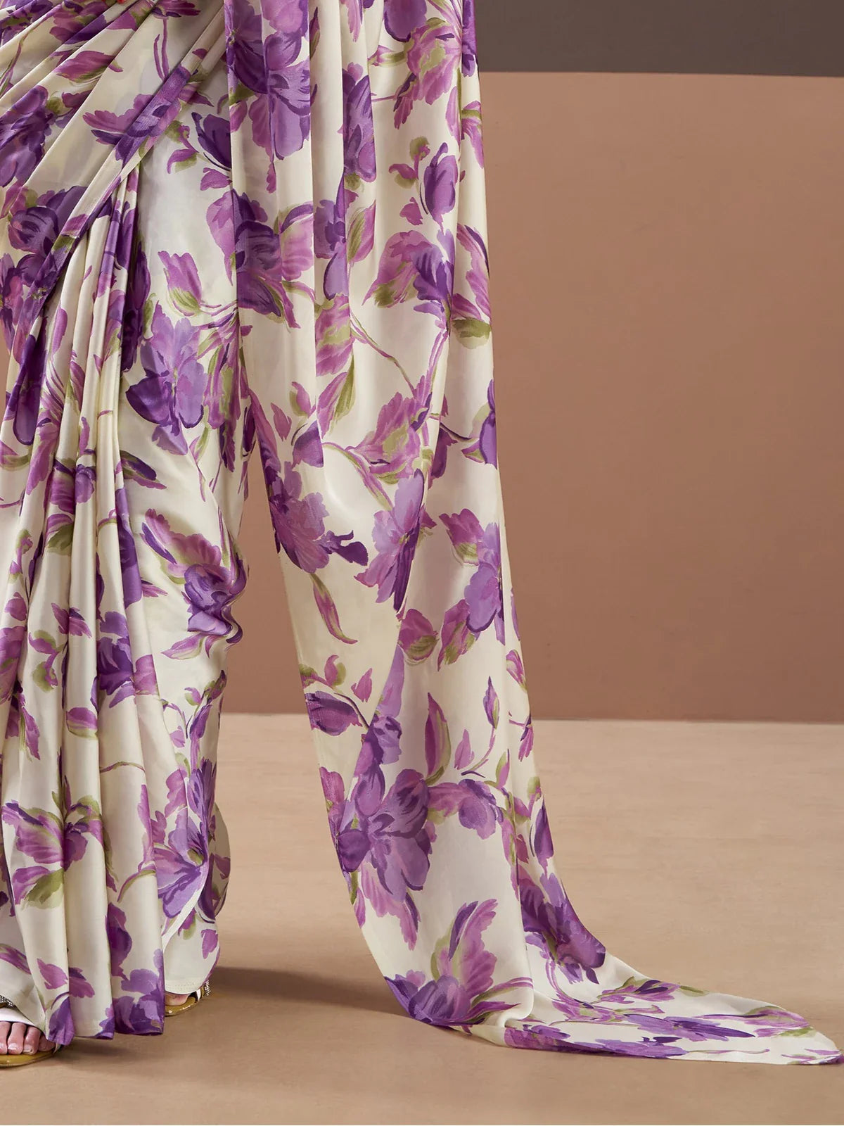 Tarani satin floral saree in cream with purple design showing fabric drape close up