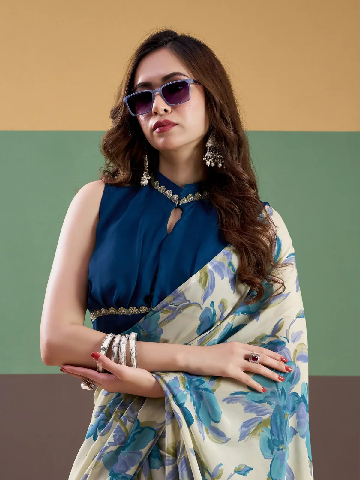 Tarani cream floral satin saree with stitched navy blouse upper body view