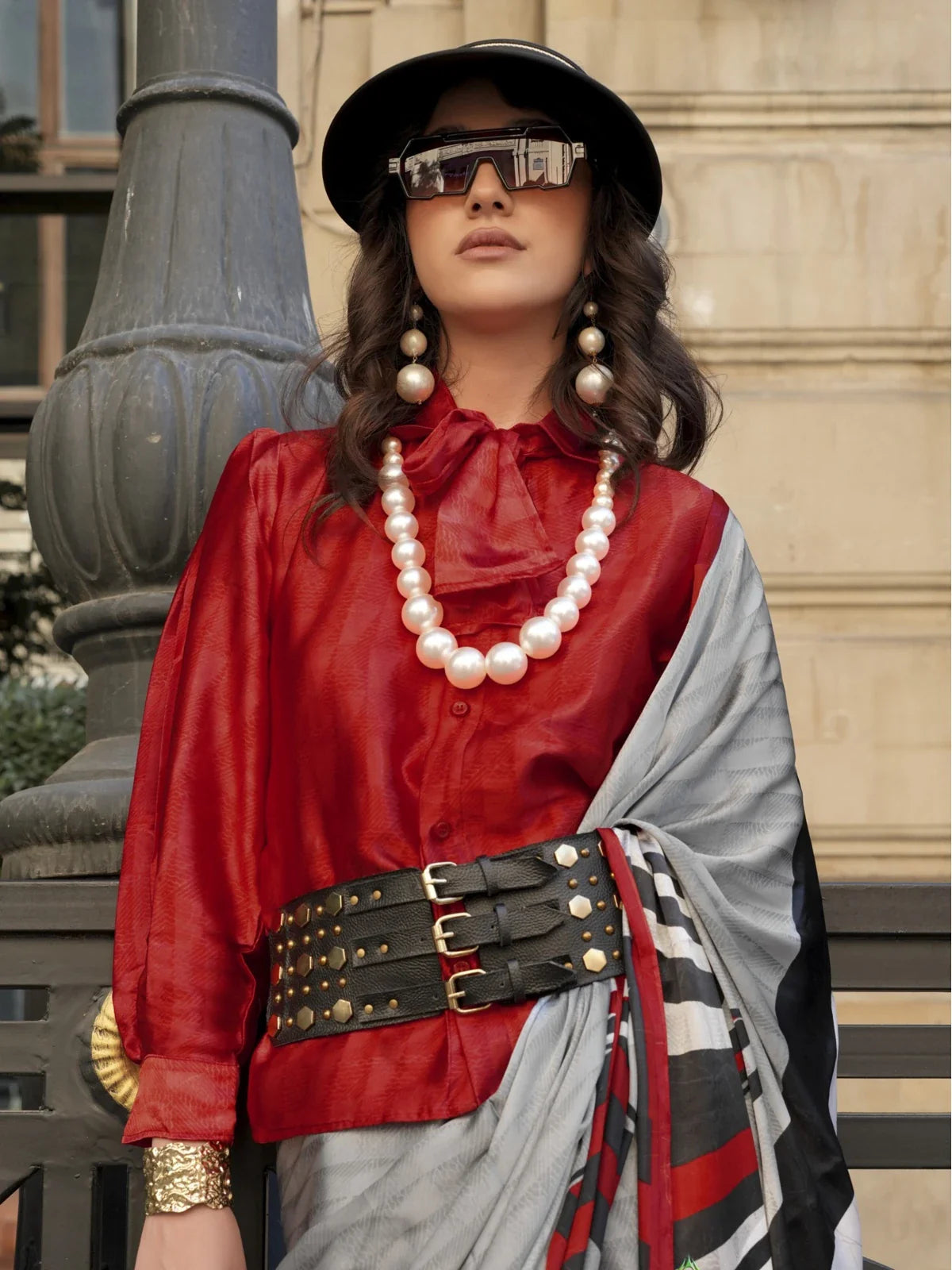 Tarani satin grey saree paired with red blouse and pearl jewellery in upper body closeup