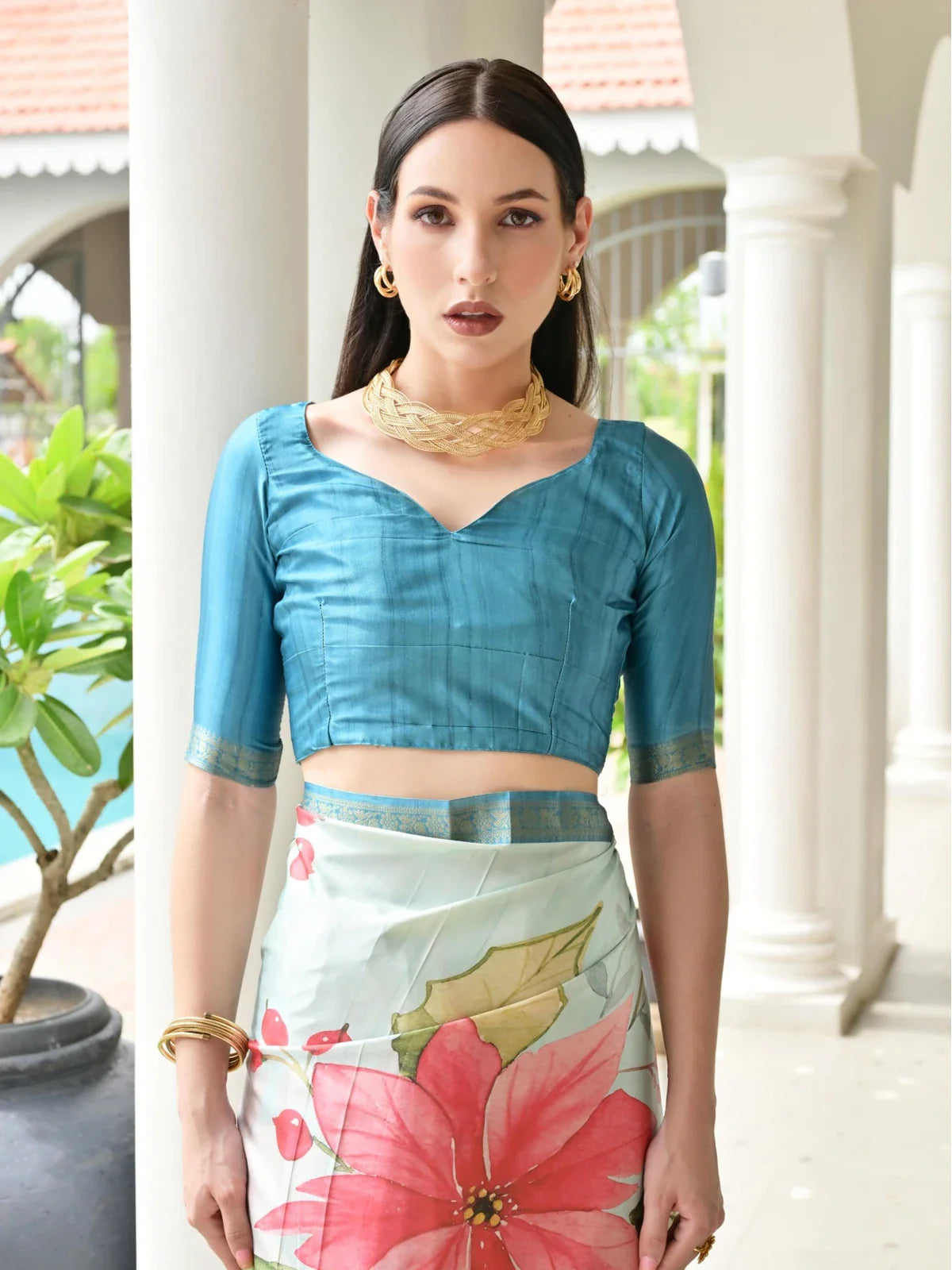 Tarani light blue satin saree with teal blue contrast blouse front pose upper body view