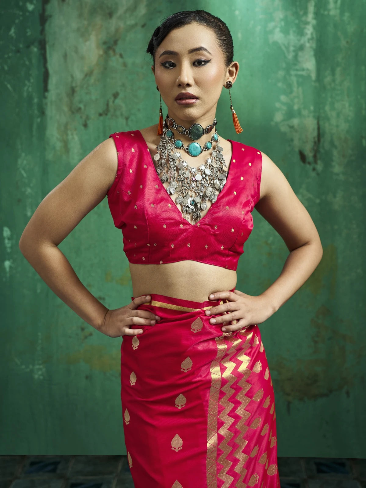 Tarani Kalpita upper body view magenta satin saree blouse with zari woven detailing