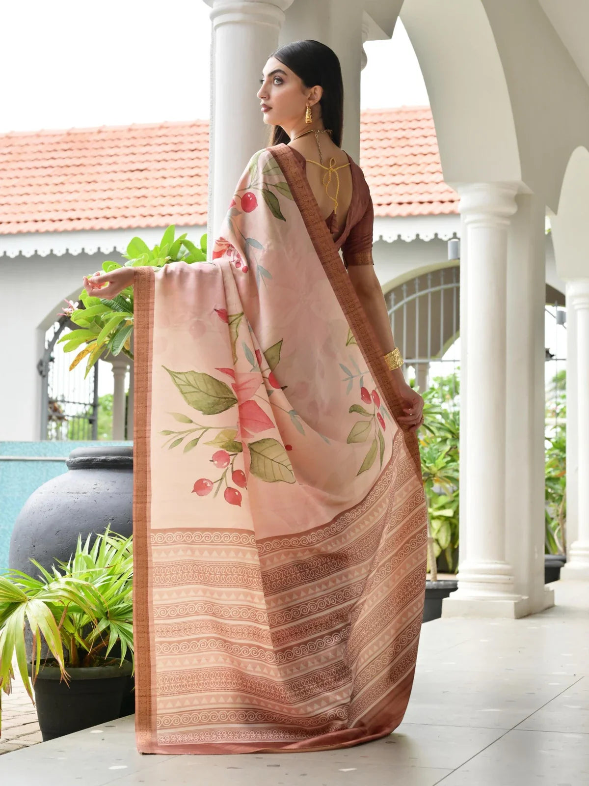 Tarani soft satin saree back pallu view with rich printed border and blouse tie-back style