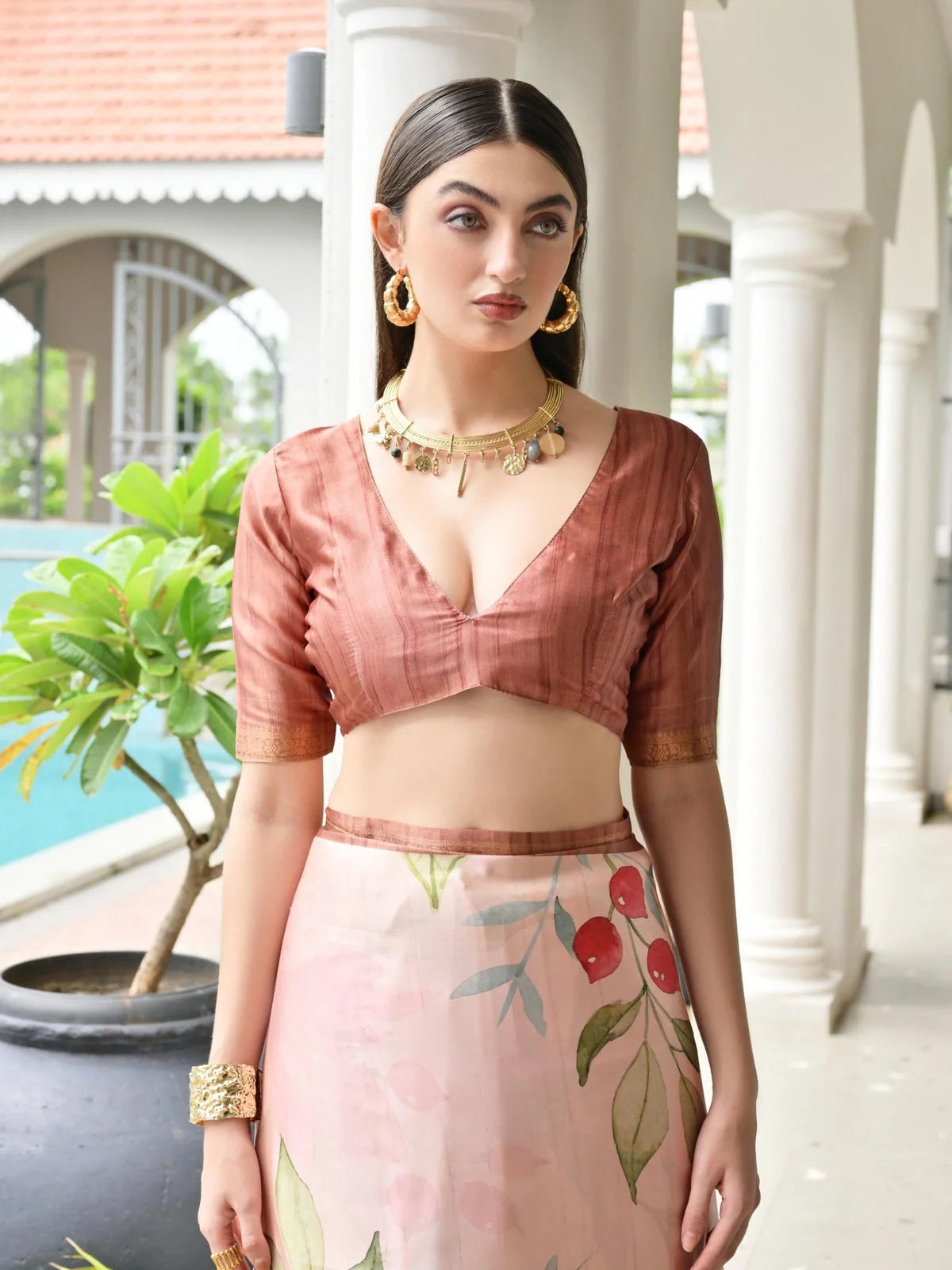 Tarani satin saree blouse close-up showing elegant neckline and elbow sleeve design