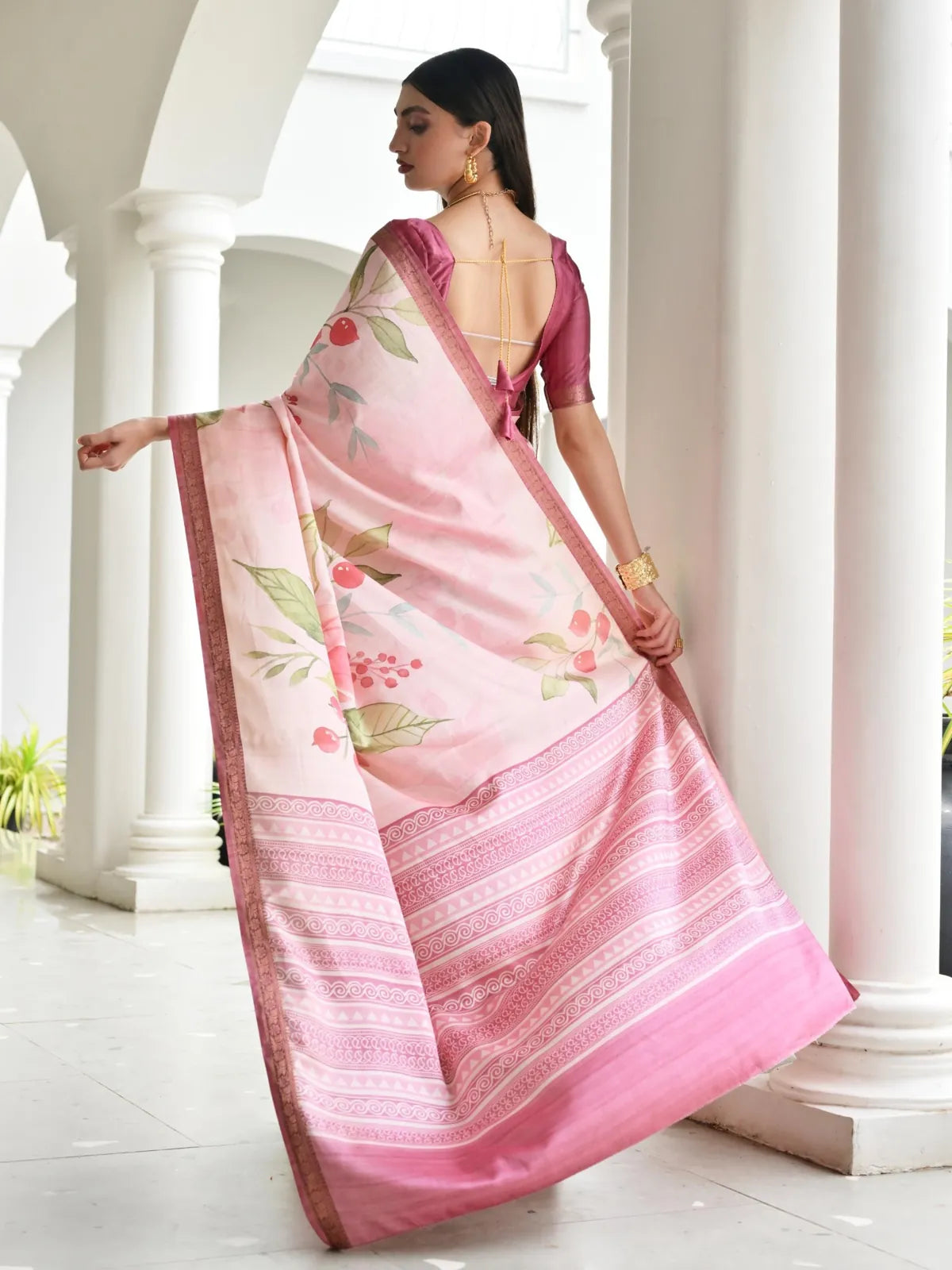 Back view of Tarani pink satin saree with flowing pallu and hand-painted floral work