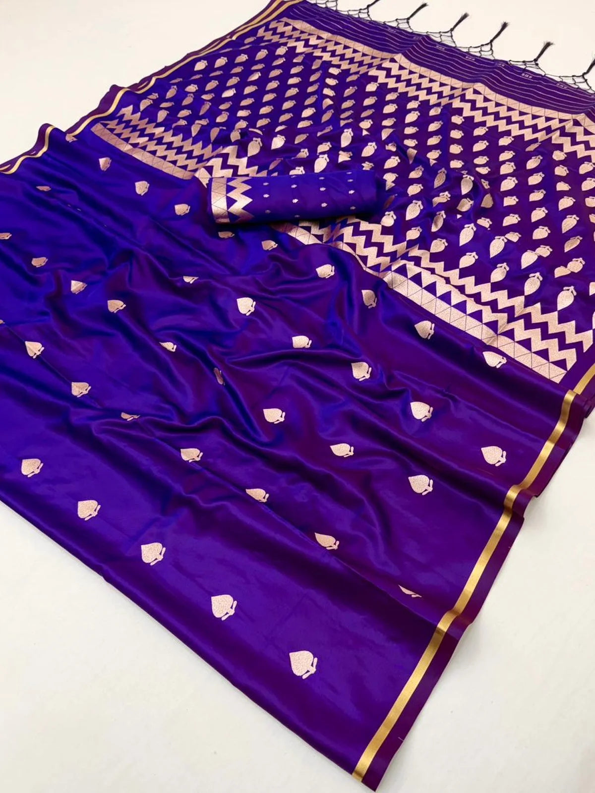 Tarani Eshanya closeup purple satin saree fabric with zari woven motifs