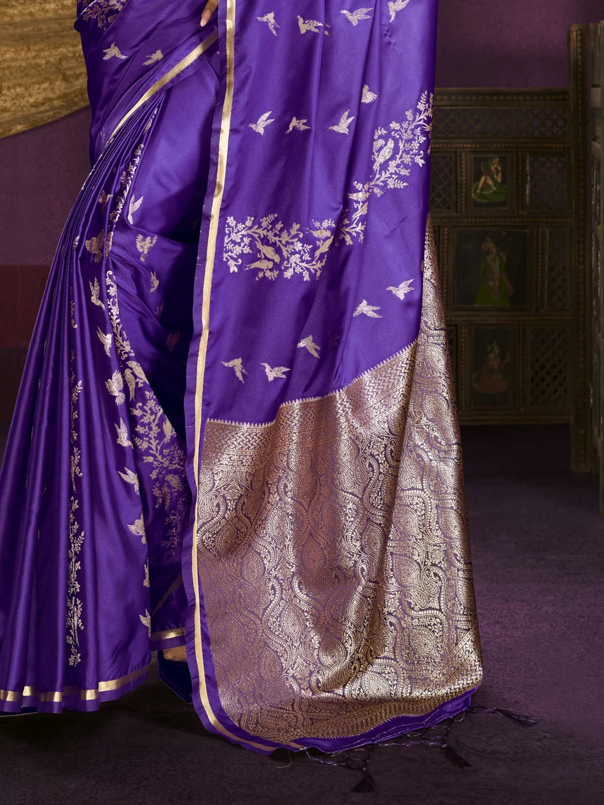 Tarani close-up of purple satin saree showing intricate bird and vine embroidery
