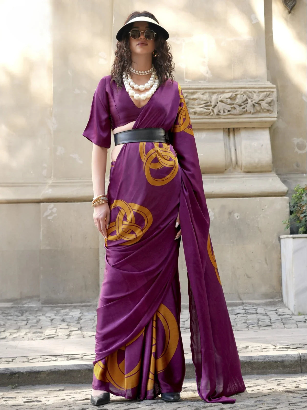 Tarani purple satin saree with bold circular motifs styled for modern casual wear