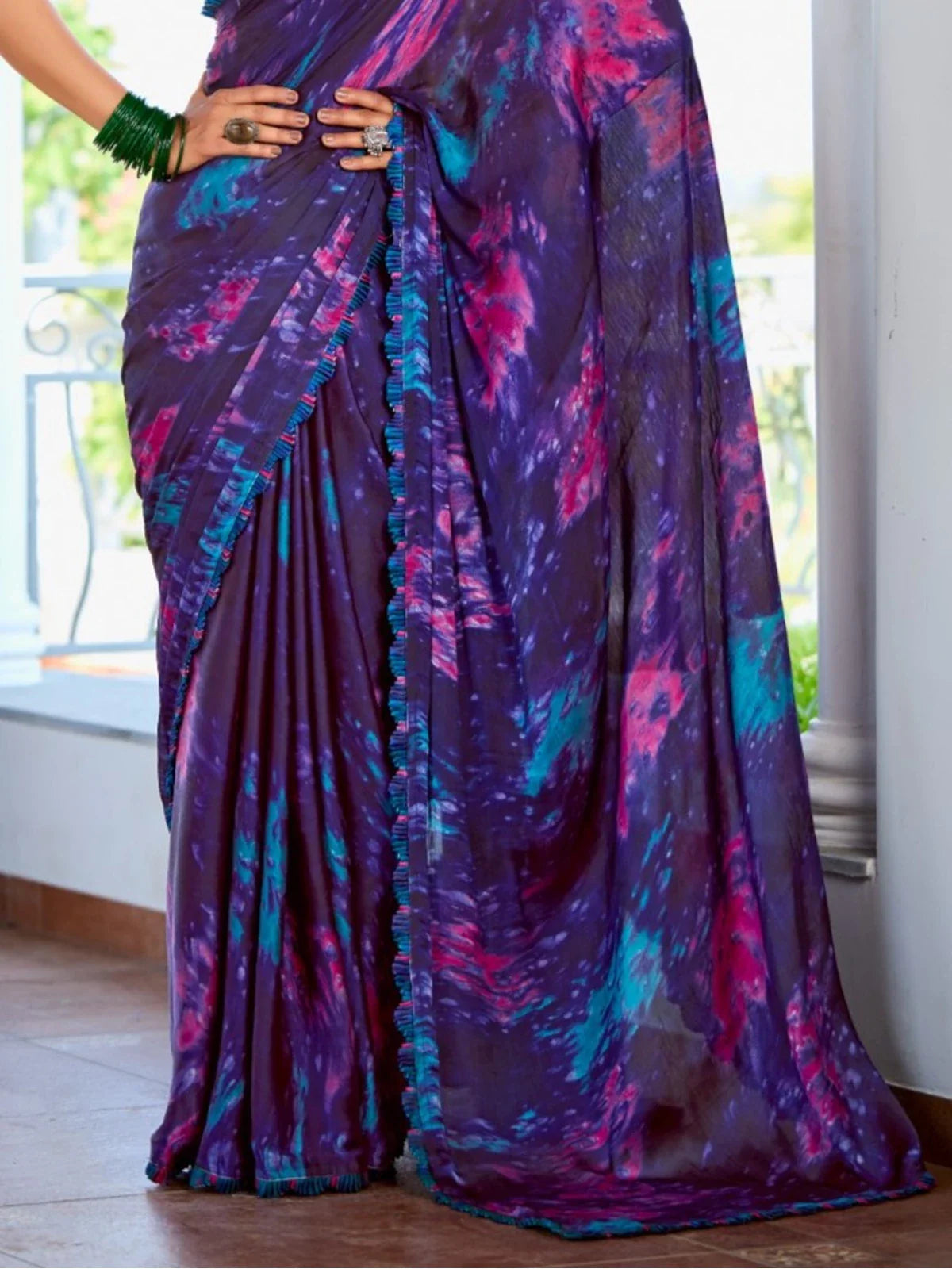 Tarani purple satin saree pallu view highlighting intricate detailing and border