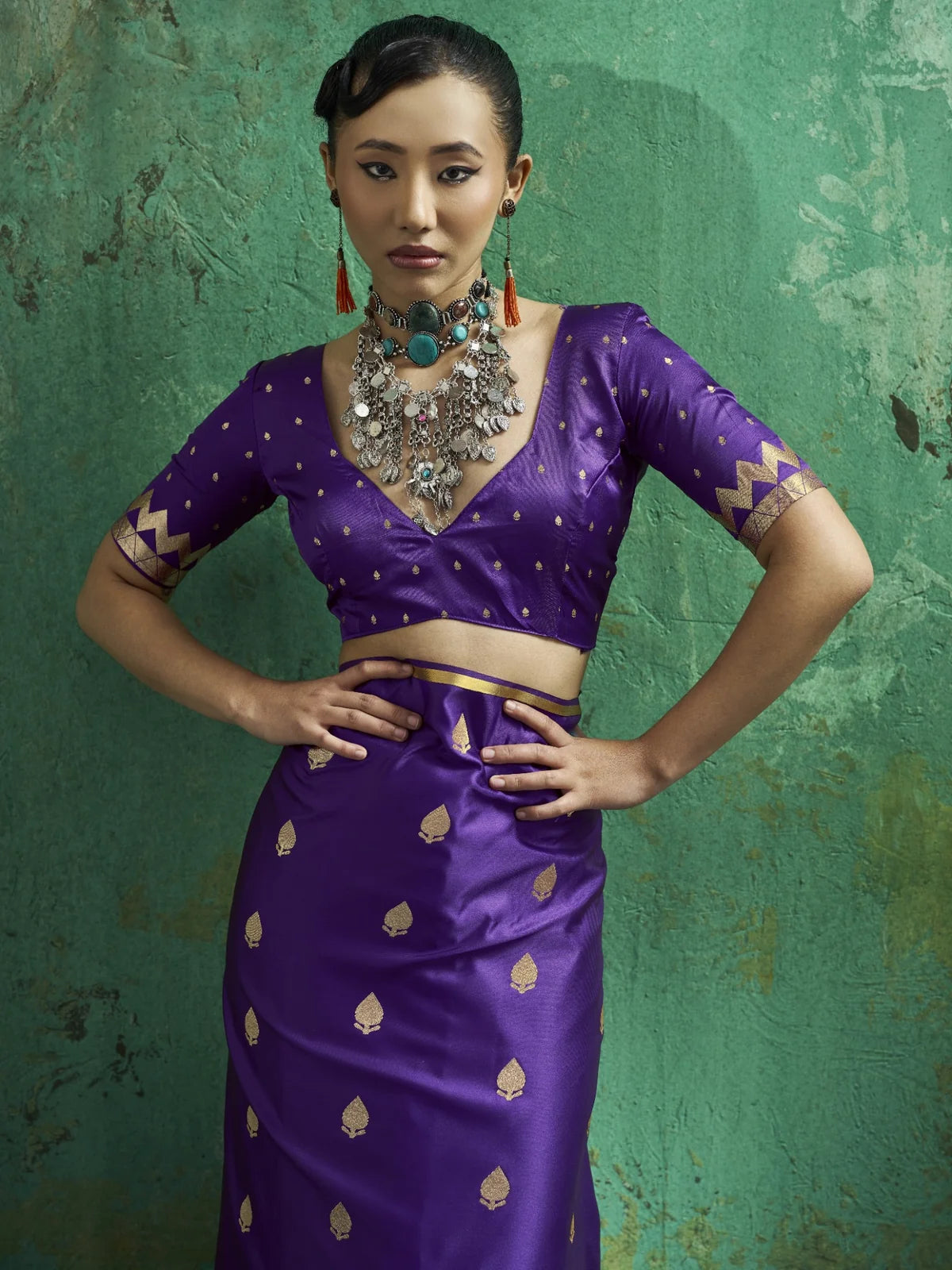 Tarani Eshanya purple satin saree upper body view showing blouse and zari motifs