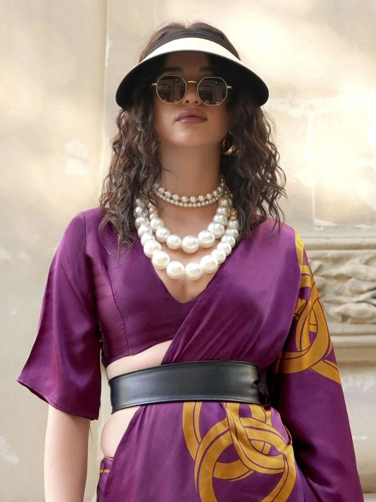 Tarani closeup of blouse and belt-style look with layered pearls and satin fabric