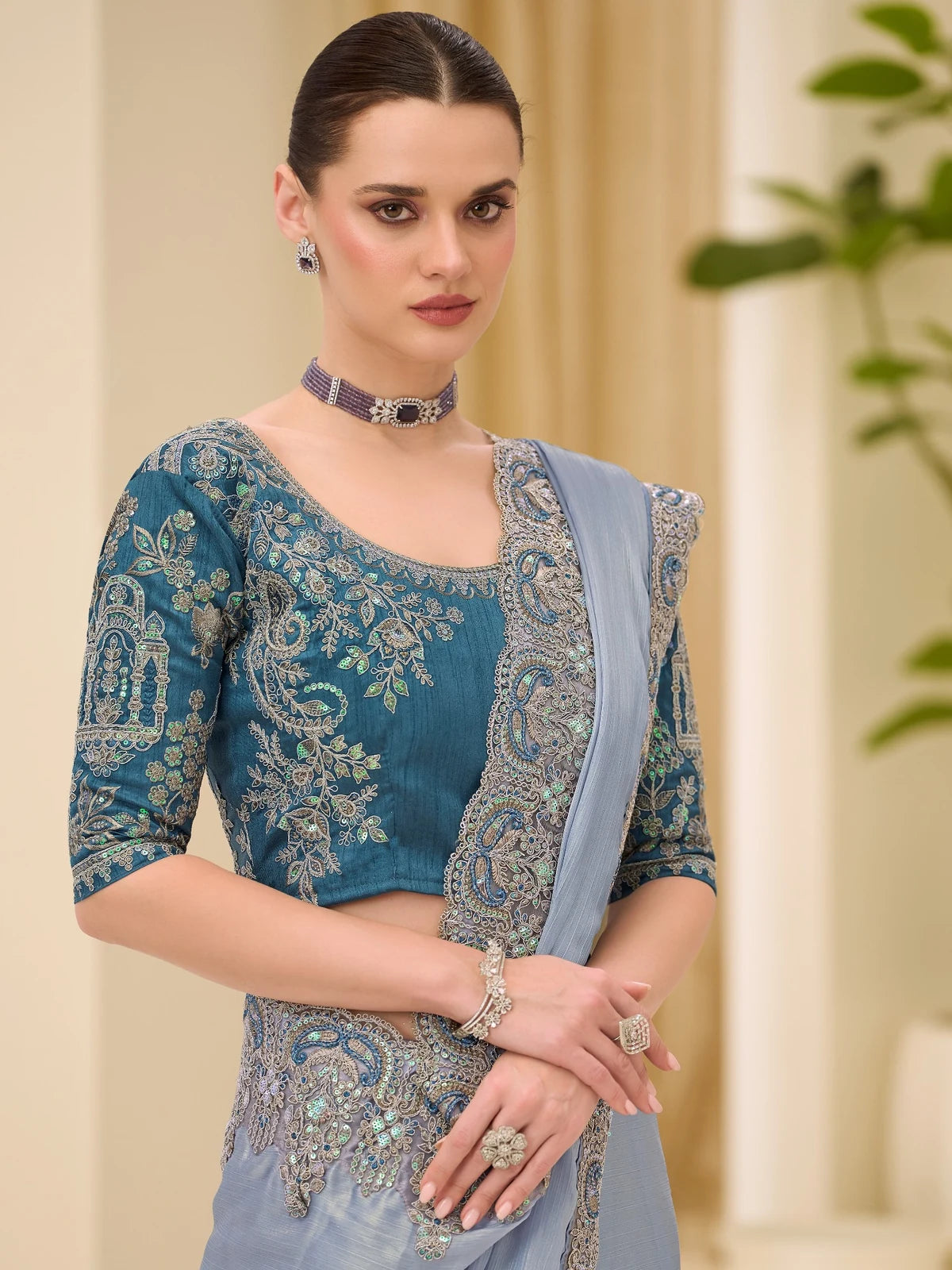 Tarani Unnati silver shimmer satin saree closeup view with intricate embroidery and border work