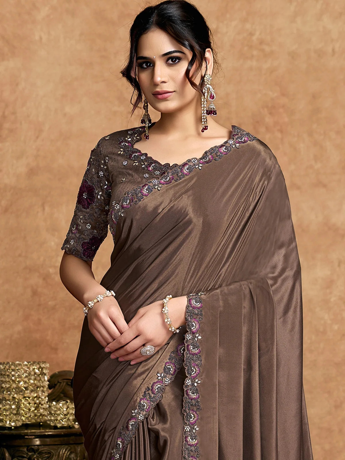 Tarani Harshita brown satin silk saree upper body view with floral applique embroidered border