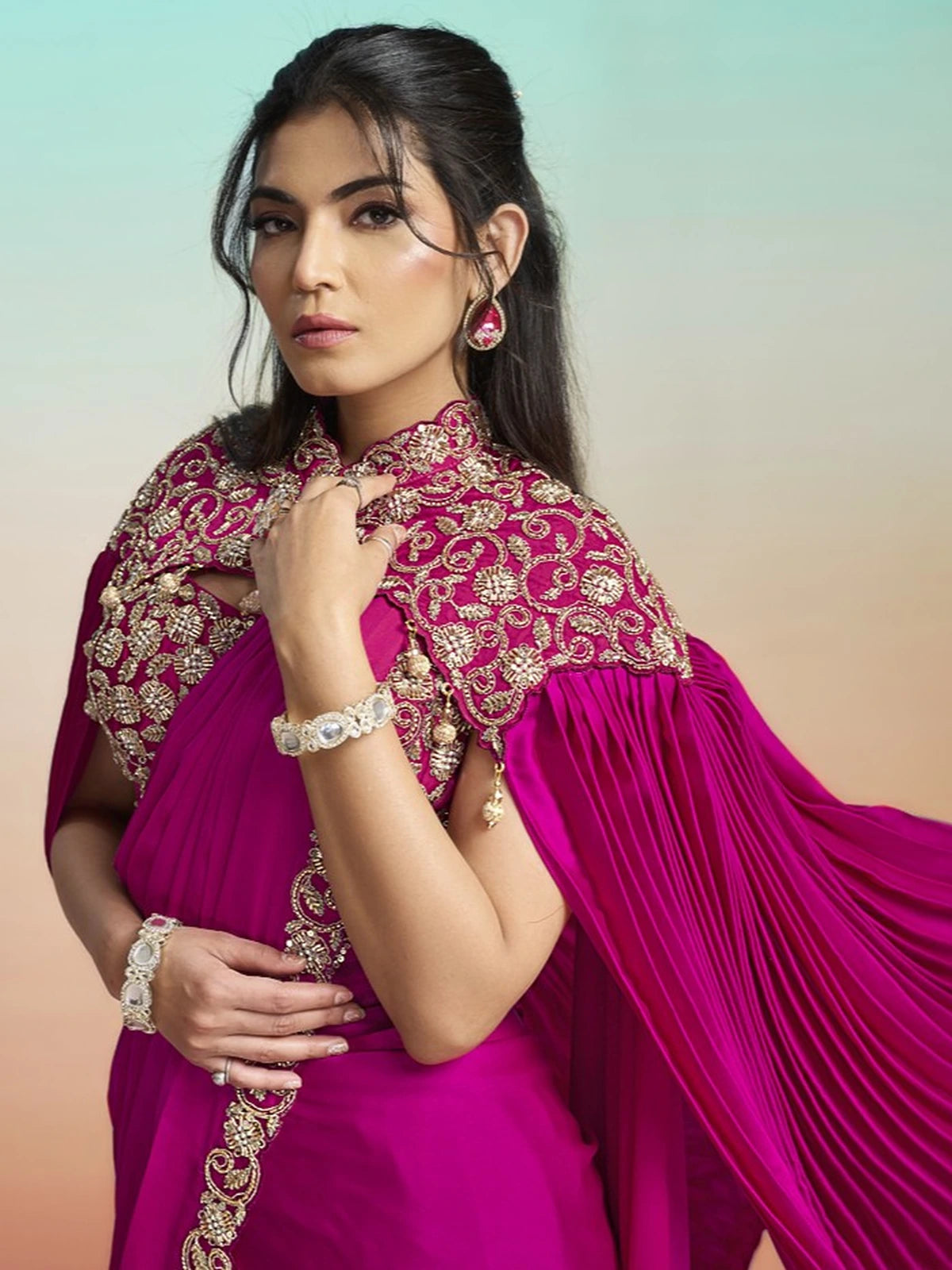 Tarani Shrishti magenta satin silk saree side view with embellished cape and detailed border