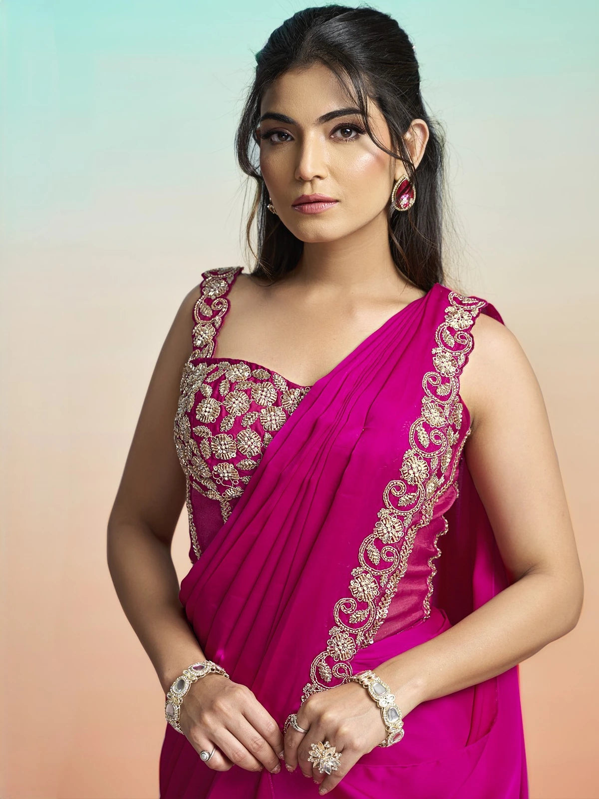 Tarani Shrishti magenta satin silk saree upper body view with zardosi corset blouse and sequin border