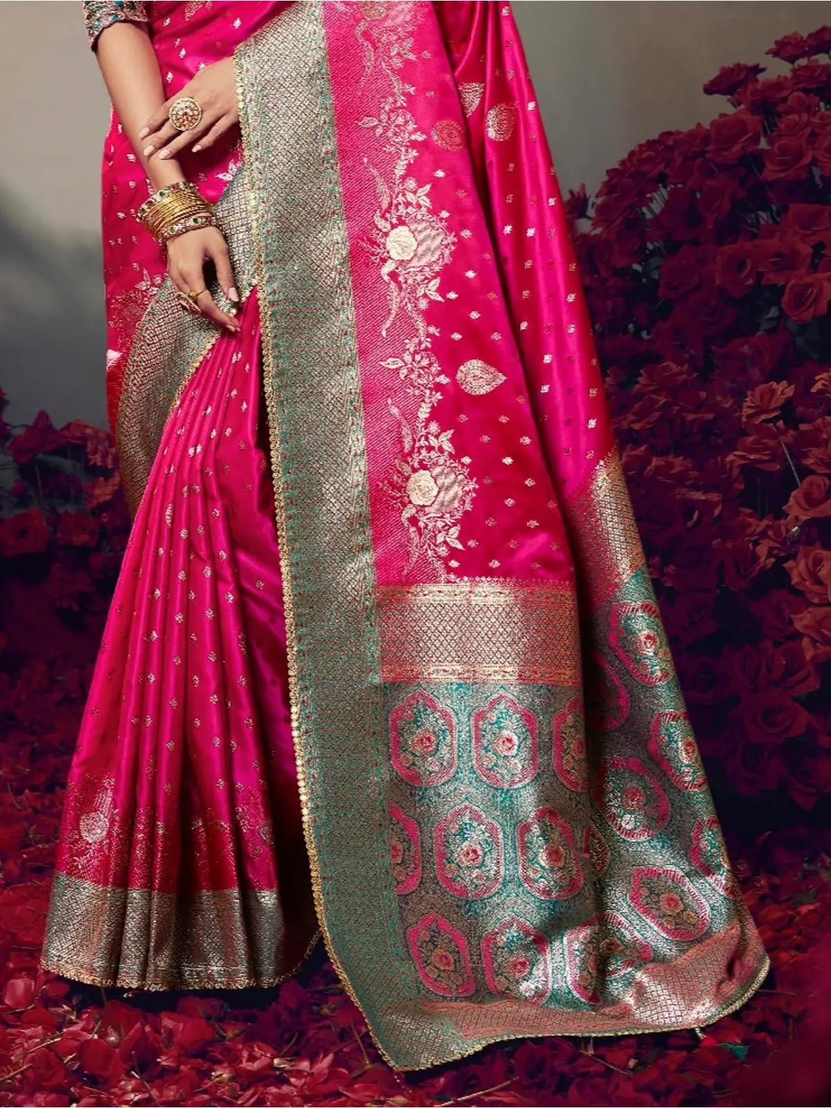 Tarani pink satin silk saree pallu view with zari border and intricate woven patterns