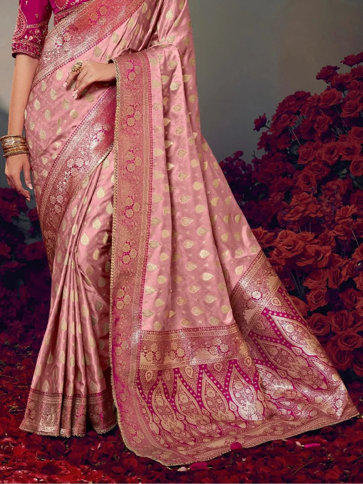Tarani pink satin silk saree pallu close-up showing intricate zari weaving