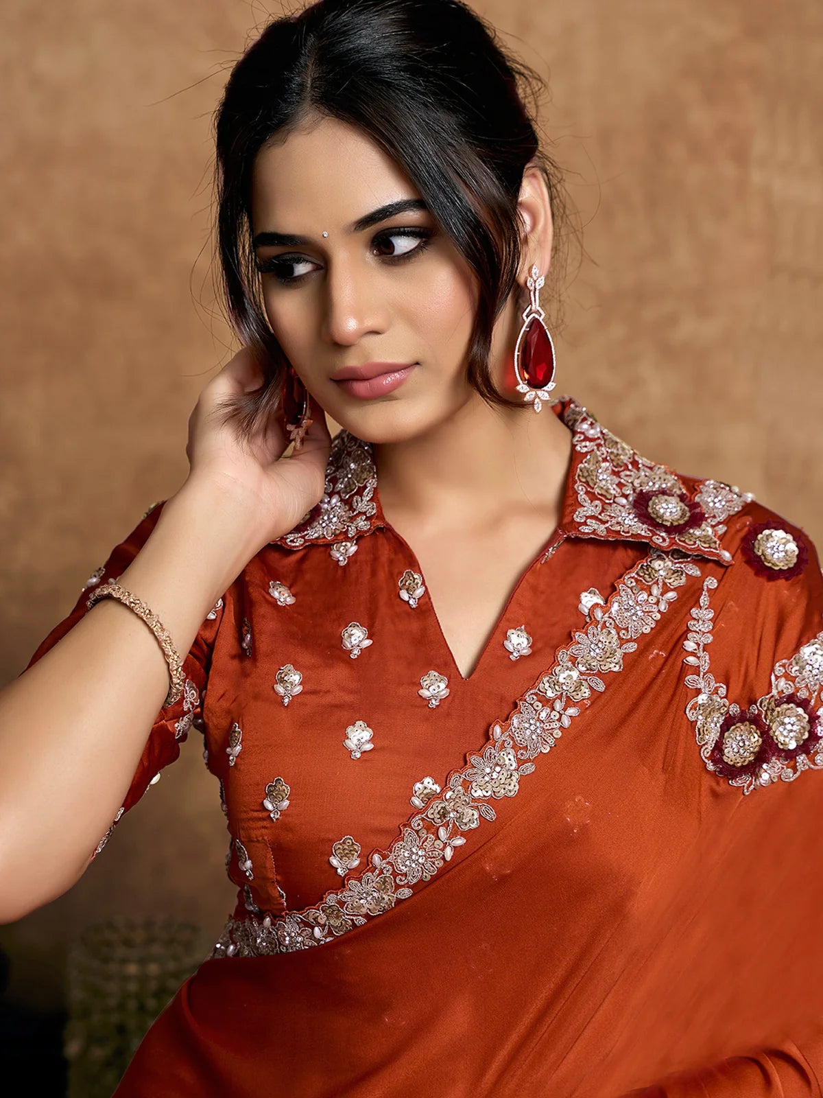 Tarani Ravina closeup view of lustrous satin silk saree with sequins pearls stones and applique floral embroidery