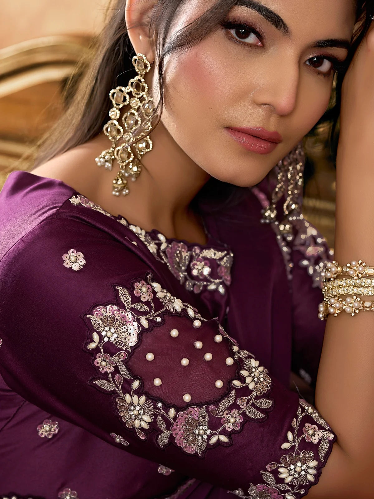 Tarani wine satin silk saree closeup showing embroidery pearls and stone detailing