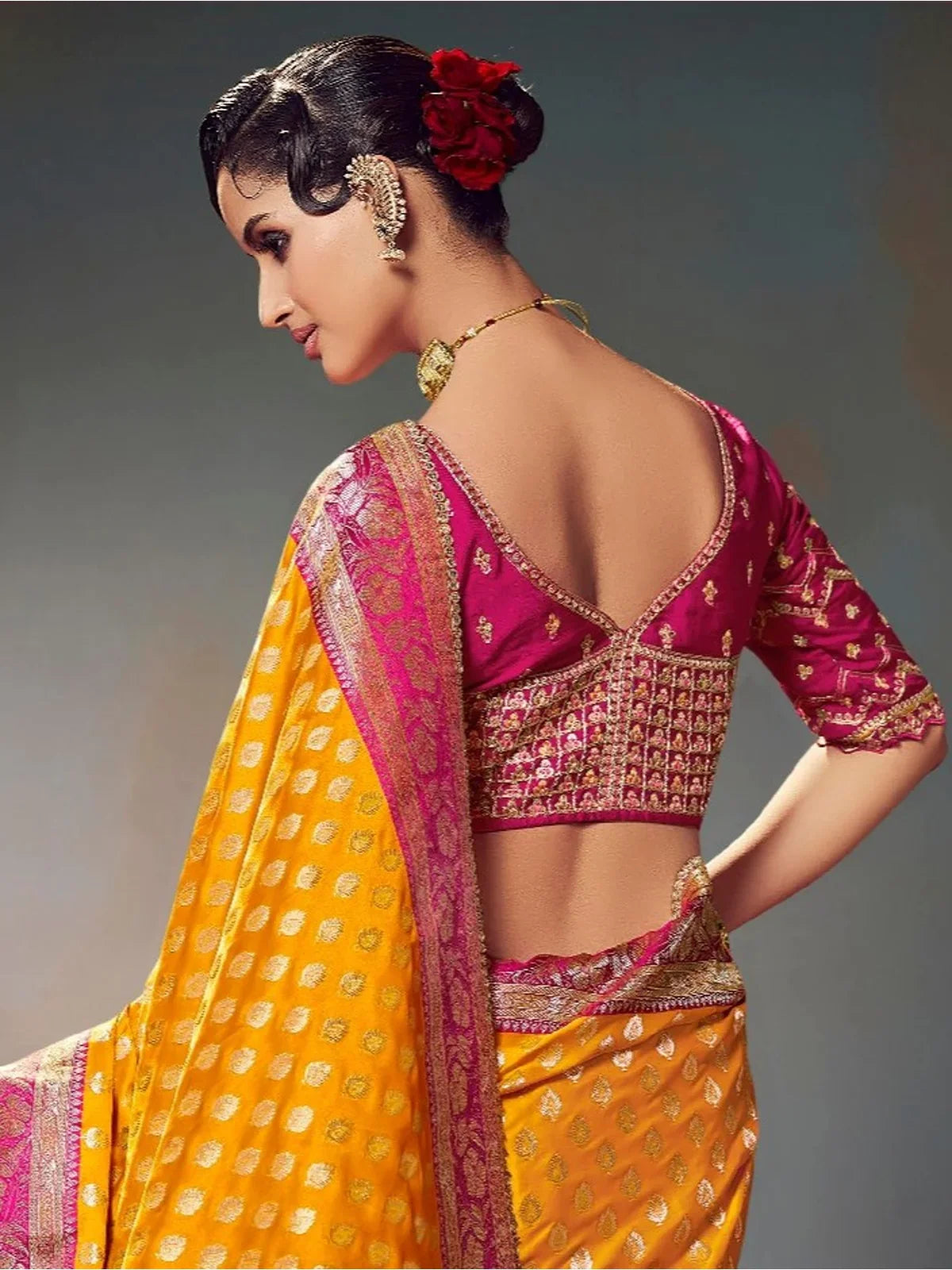 Tarani yellow satin silk saree showing elegant blouse back design