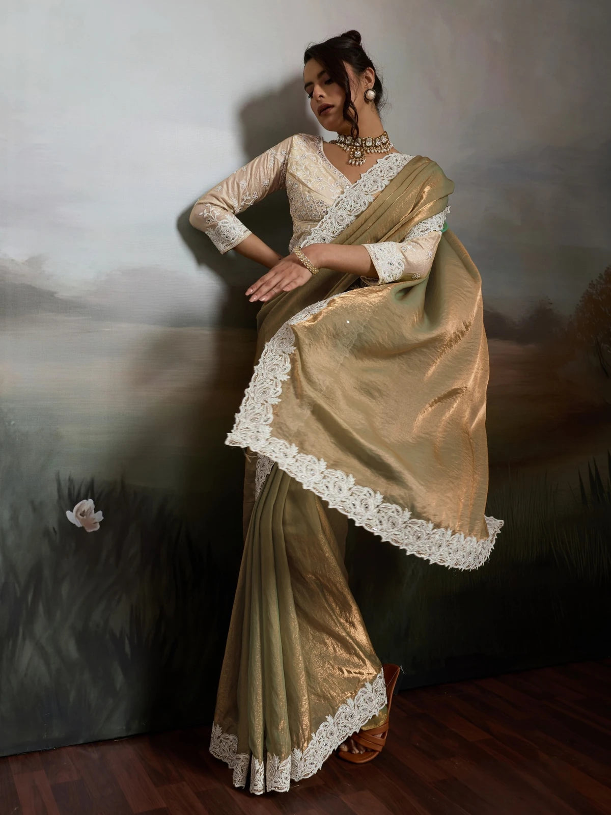 Tarani golden satin velvet saree pallu view with ivory lace border and elegant drape