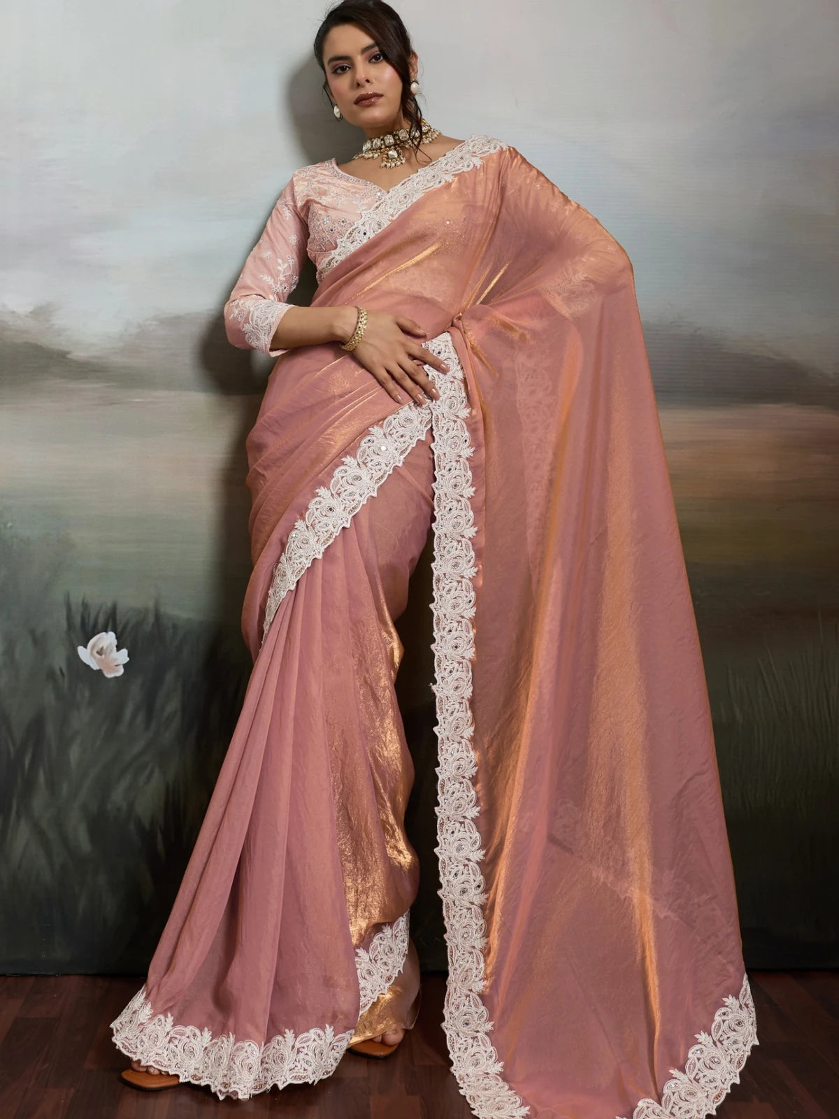 Tarani designer peach satin velvet saree front view with ivory lace border and elegant drape
