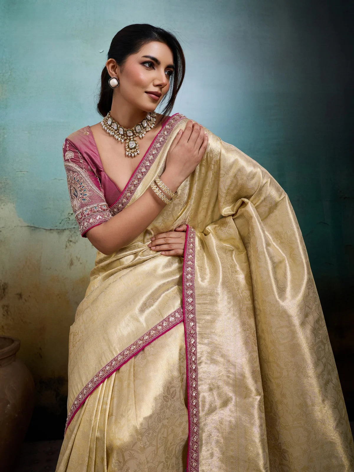 Tarani golden tissue Banarasi saree upper body view with detailed pink embroidered blouse