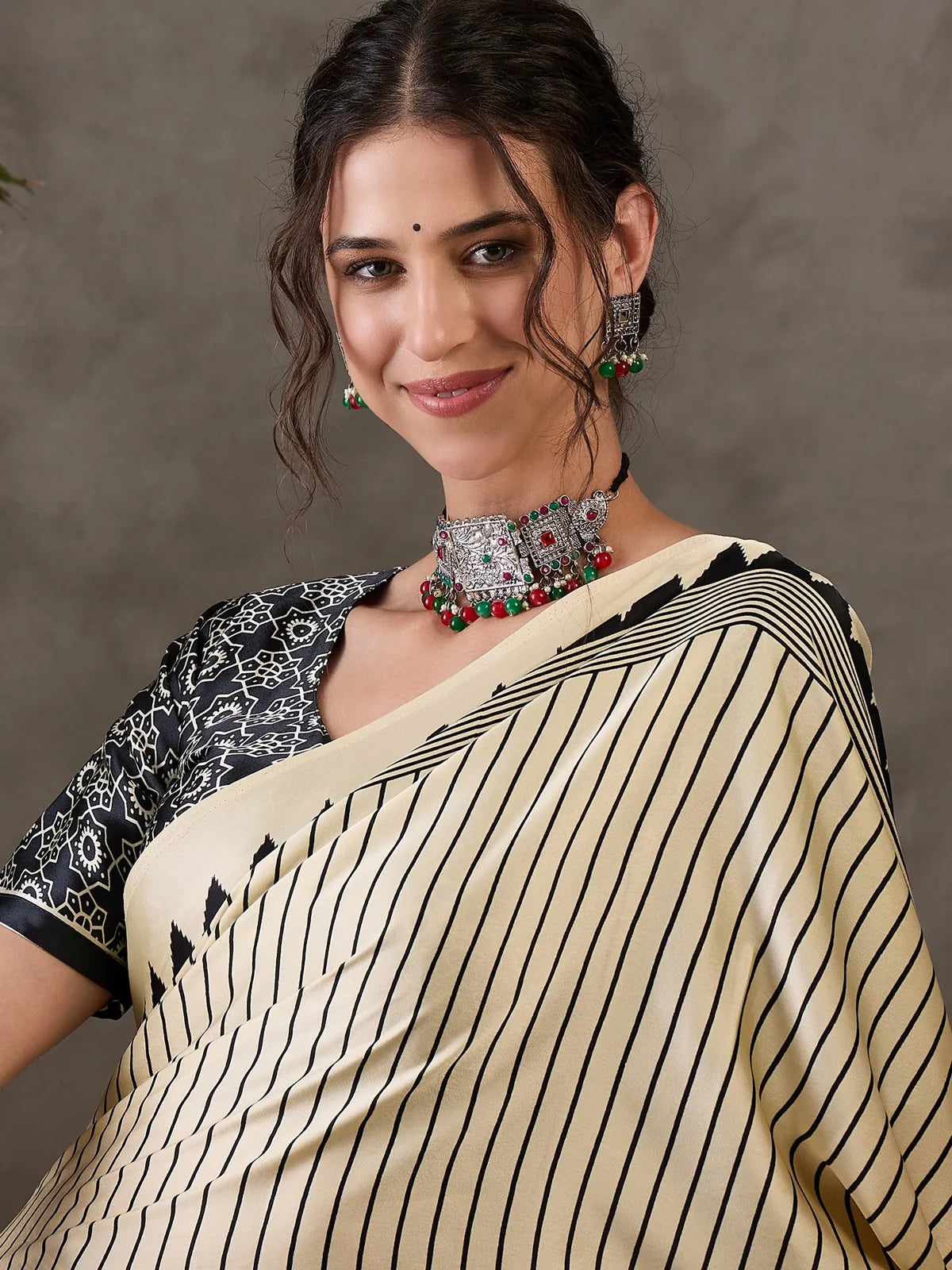 Tarani beige saree closeup view with striped pattern detailing