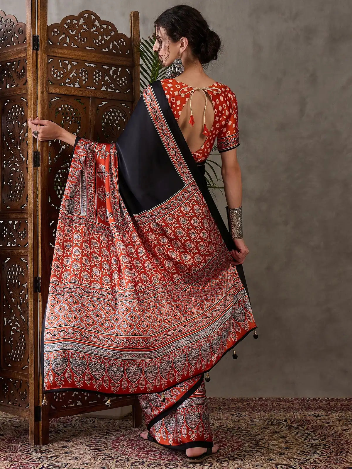Tarani black semi modal satin saree back view showing blouse back design