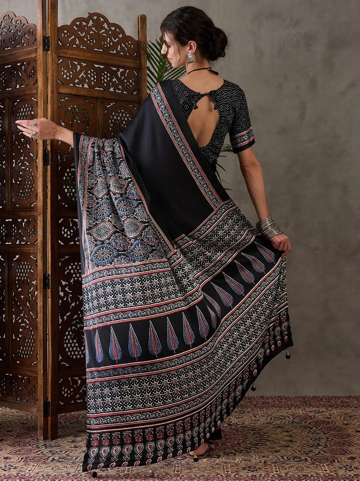 Tarani black semi modal satin saree back view with blouse back pattern