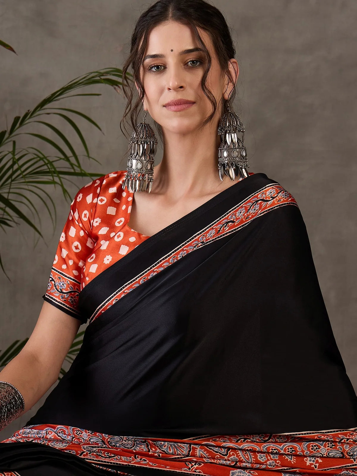 Tarani black semi modal satin saree front portrait view with elegant printed border