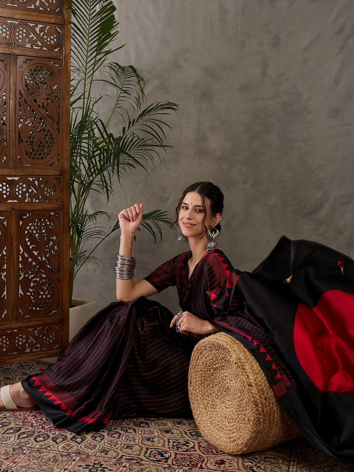 Tarani Rajvi front view black printed saree with blouse piece for festive wear