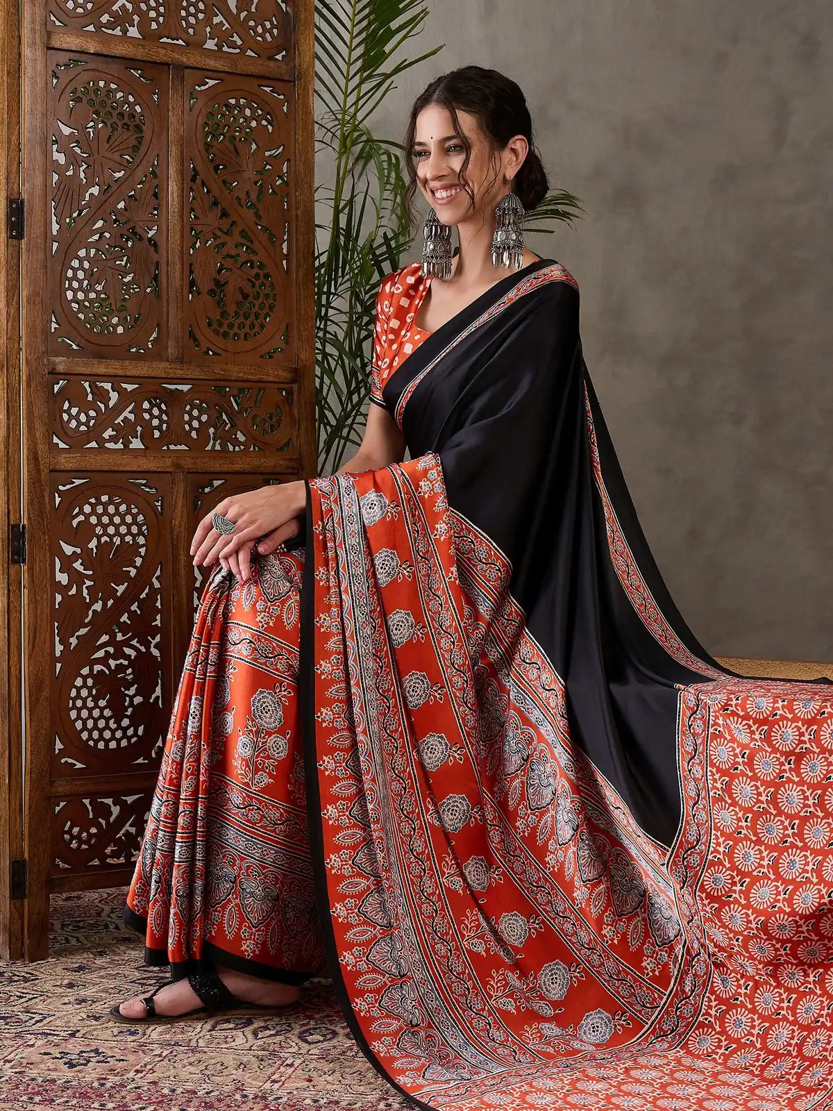 Tarani black festive saree full drape view with rich printed detailing