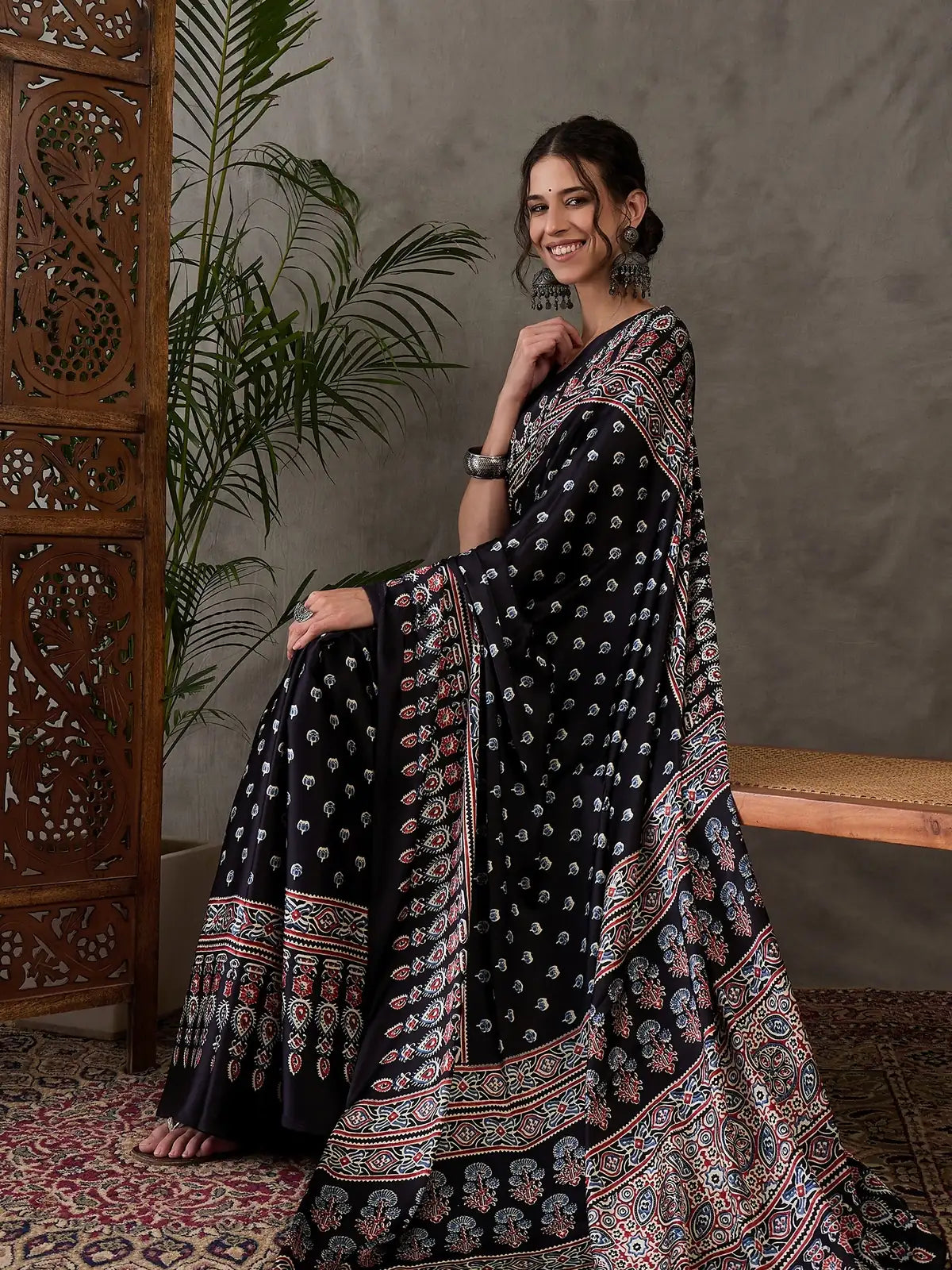 Tarani black printed saree side pose showing pallu drape Chetali