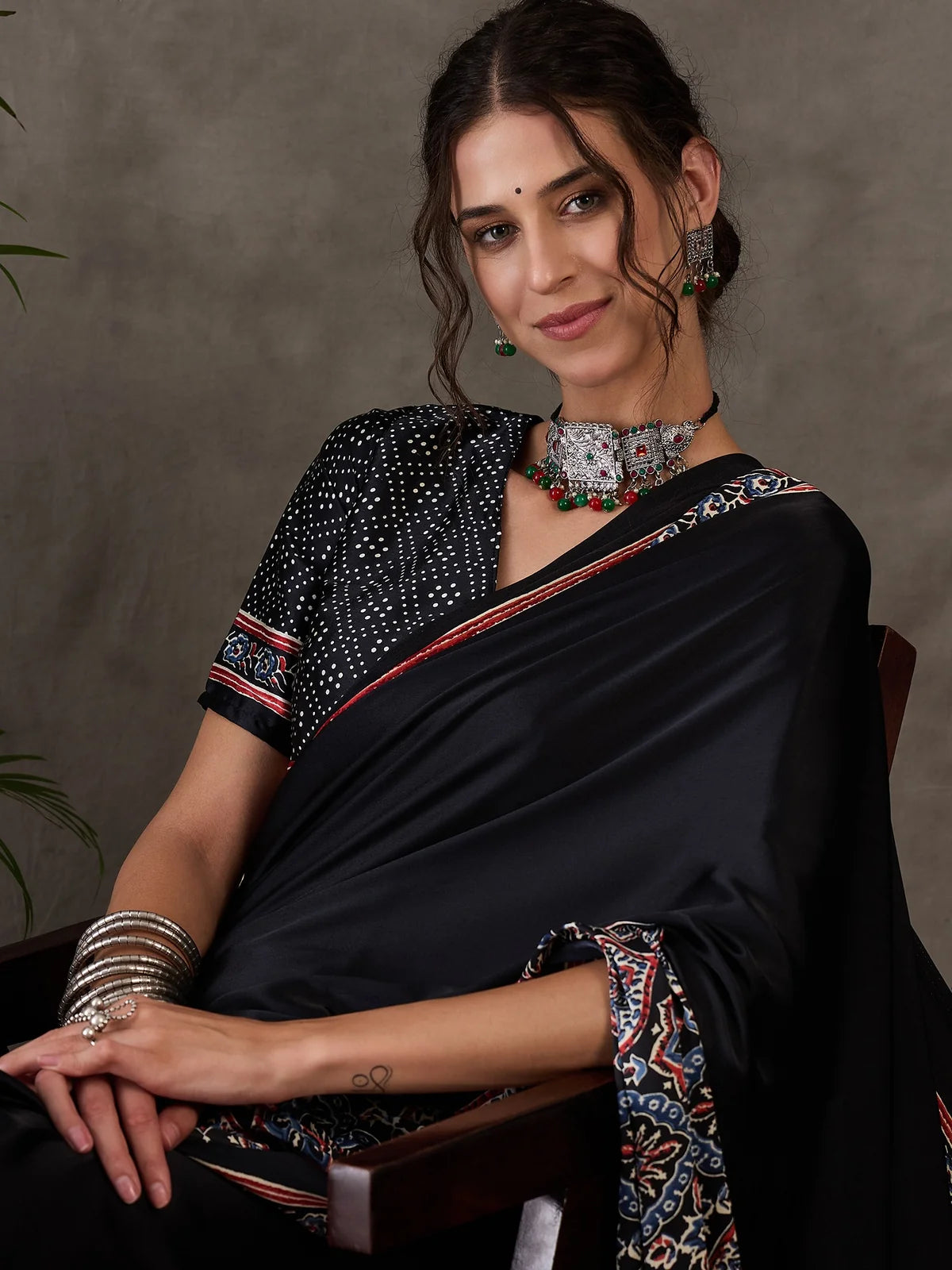 Tarani black semi modal satin saree close upper body portrait with printed blouse
