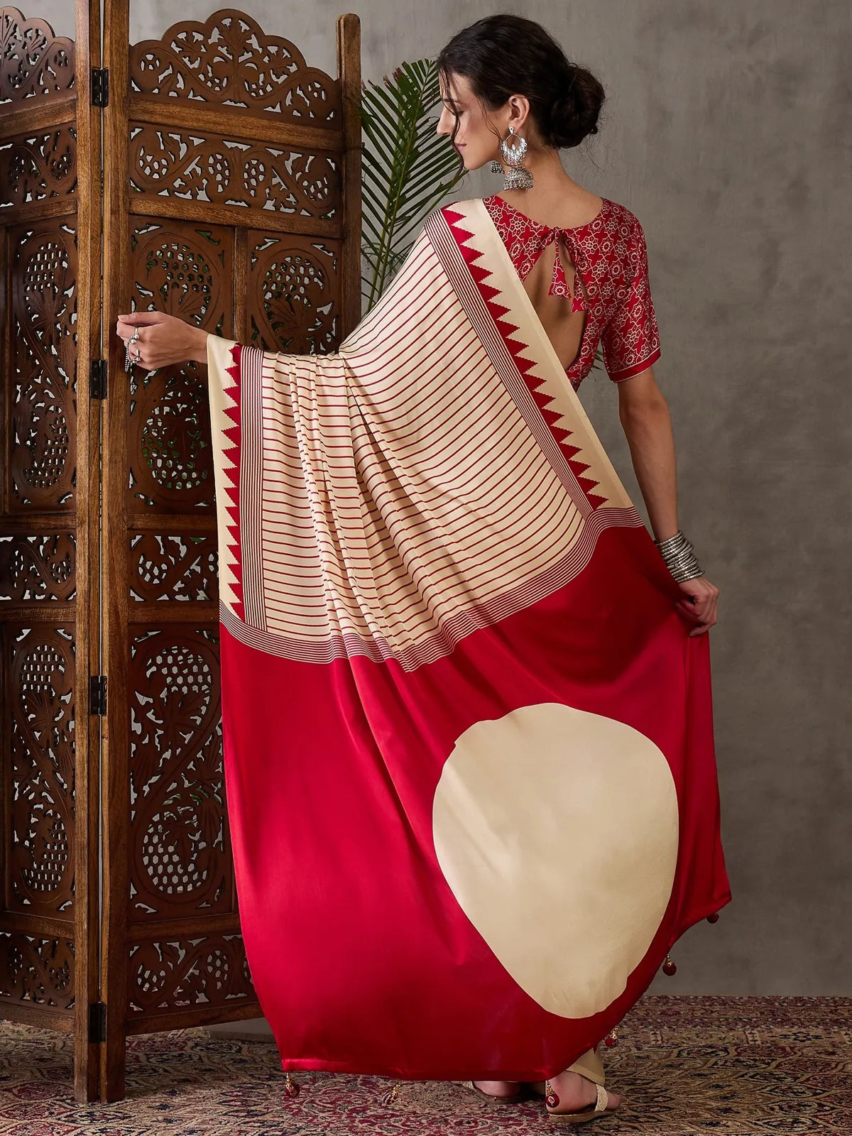 Tarani Malini saree back view showing blouse back design and pallu