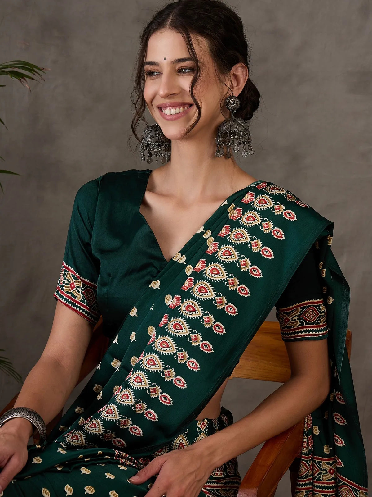 Tarani Mahika green semi modal satin saree closeup view highlighting print and drape