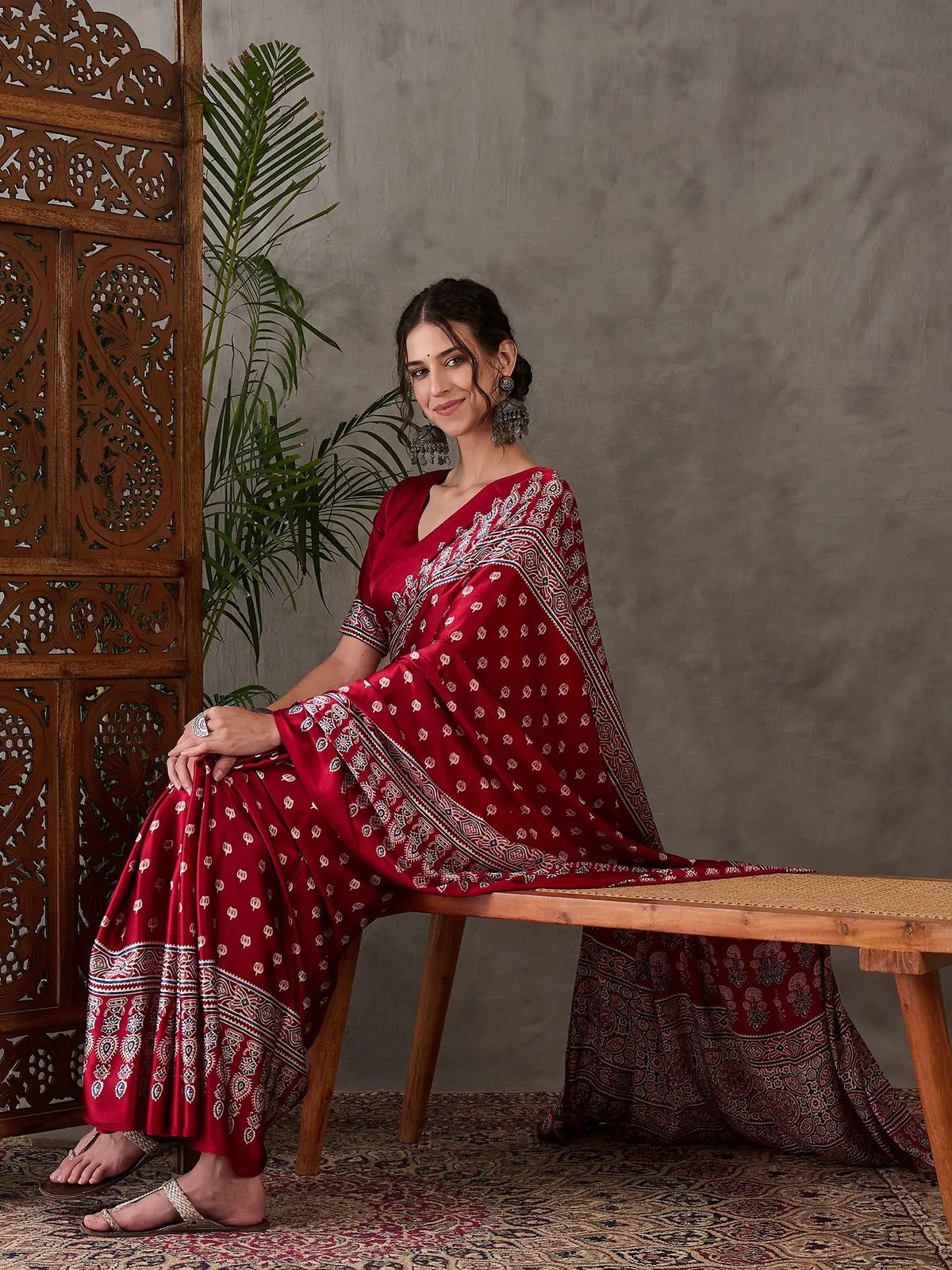 Tarani Rajlaxmi maroon printed semi modal satin saree front pose festival wear