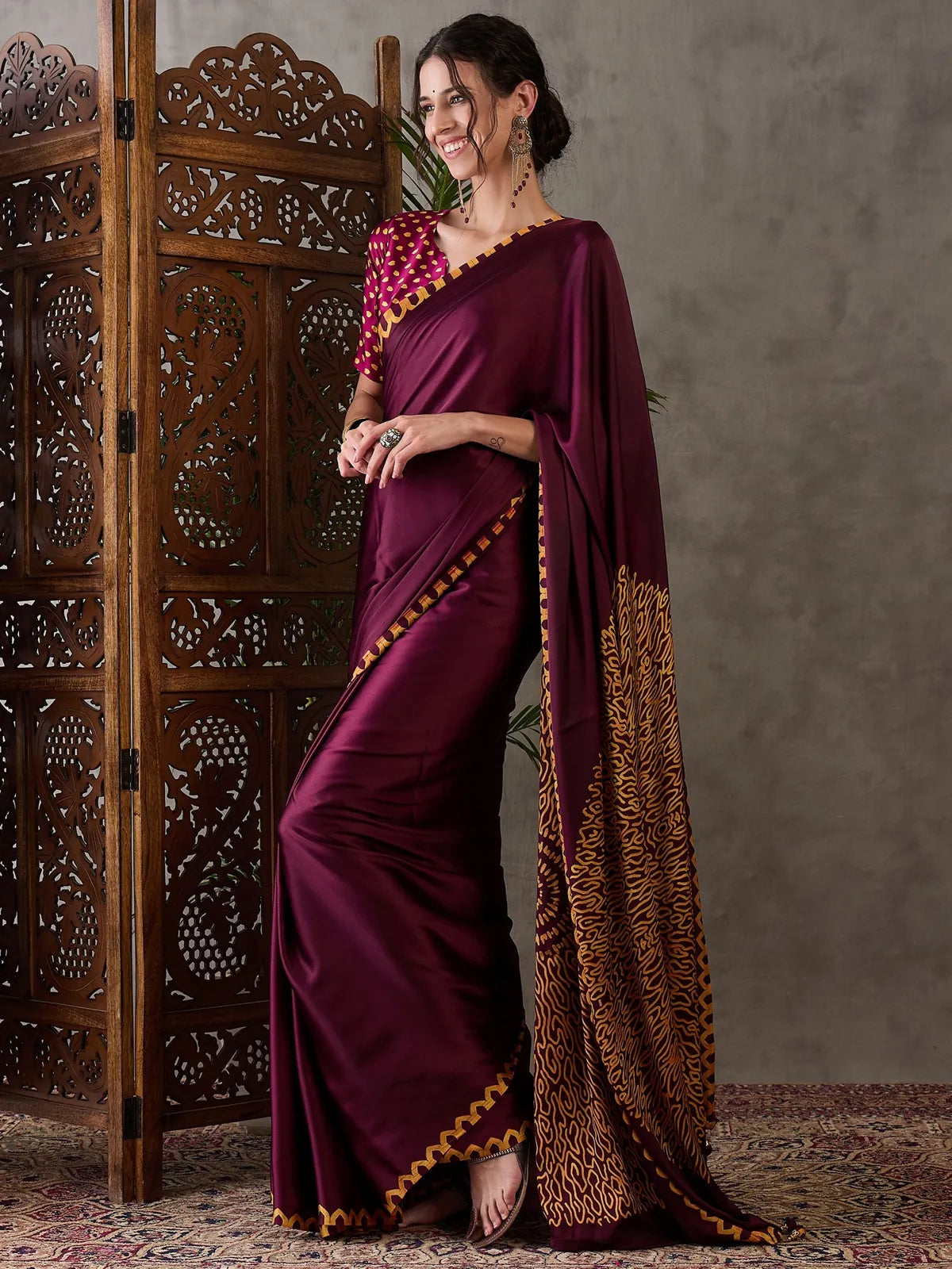 Tarani maroon semi modal satin saree side pose with designer pallu Dhruti