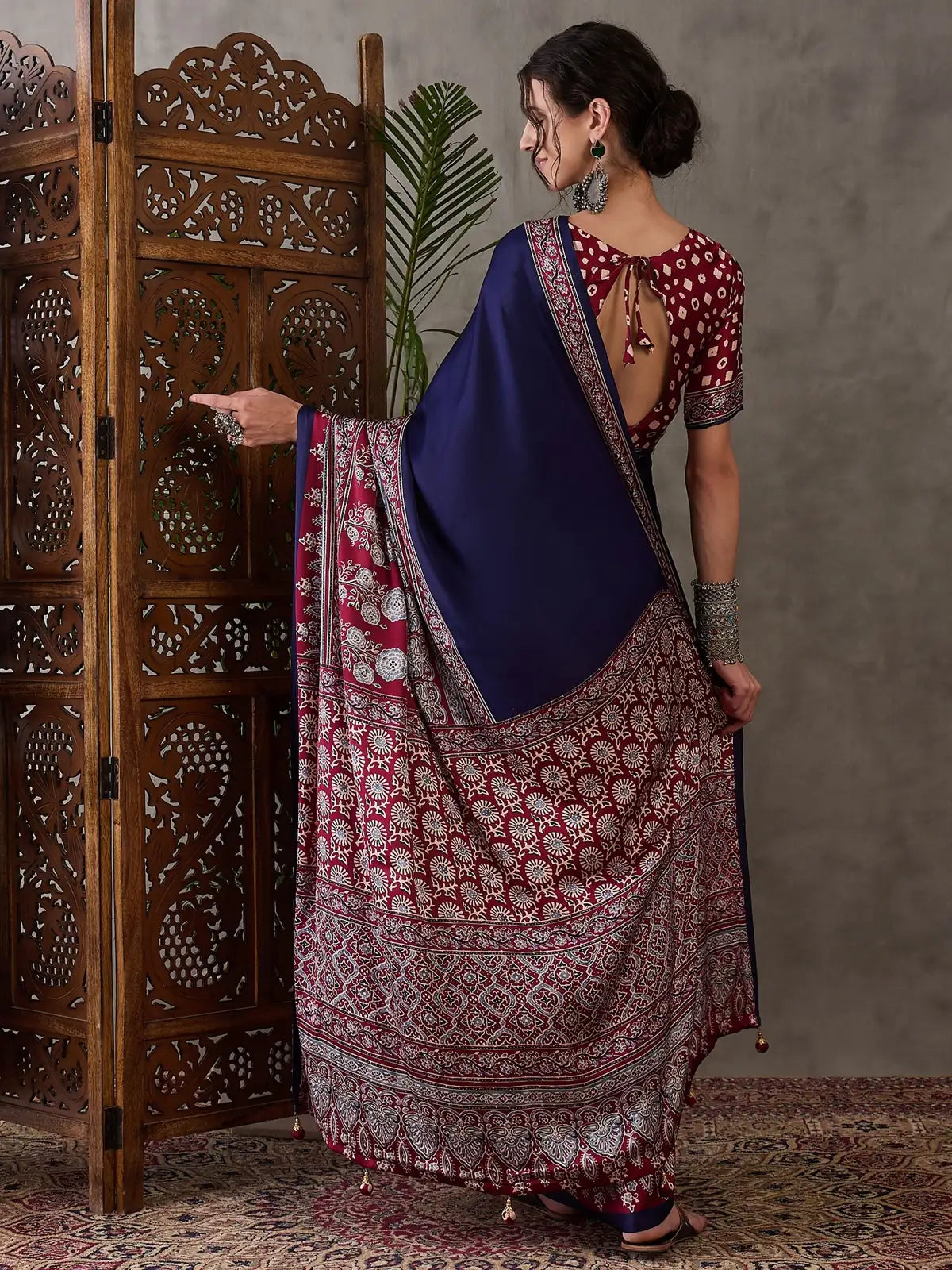 Tarani Ishaniya navy blue semi modal satin saree back view showing blouse back pattern
