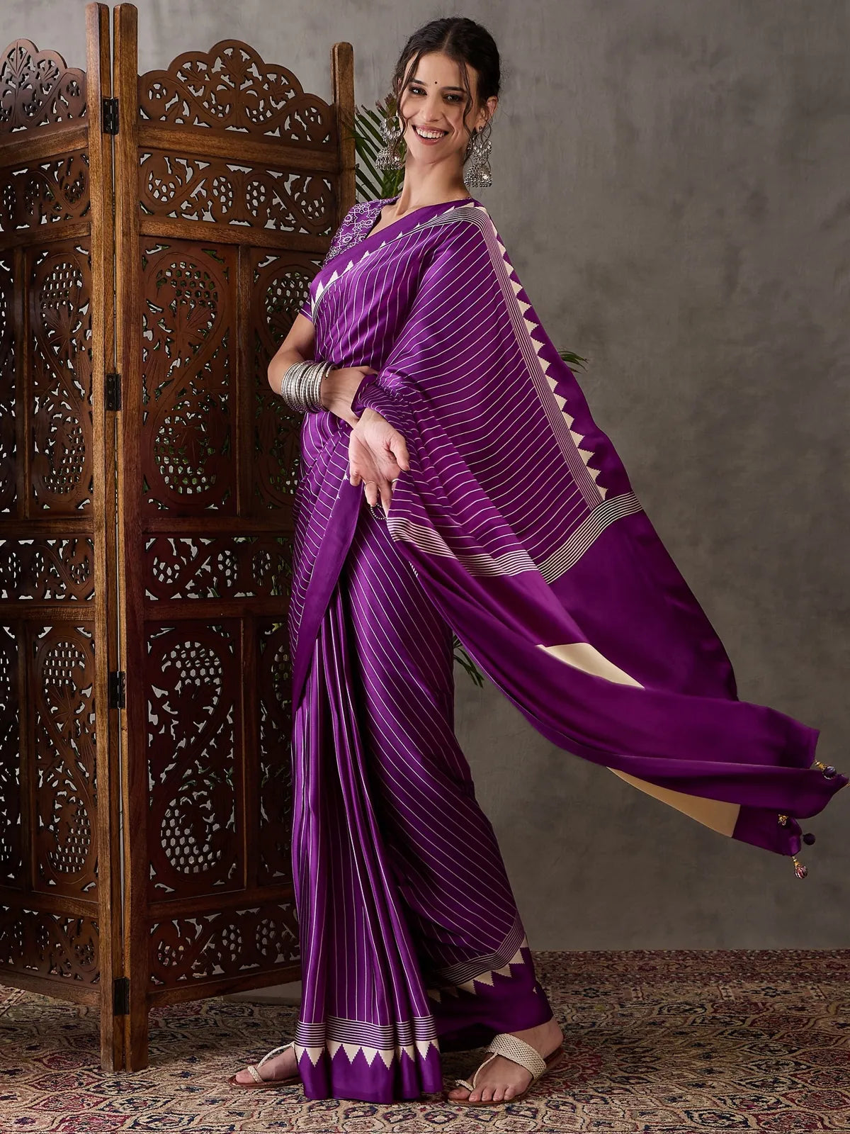 Tarani purple semi modal satin saree side view showcasing graceful drape