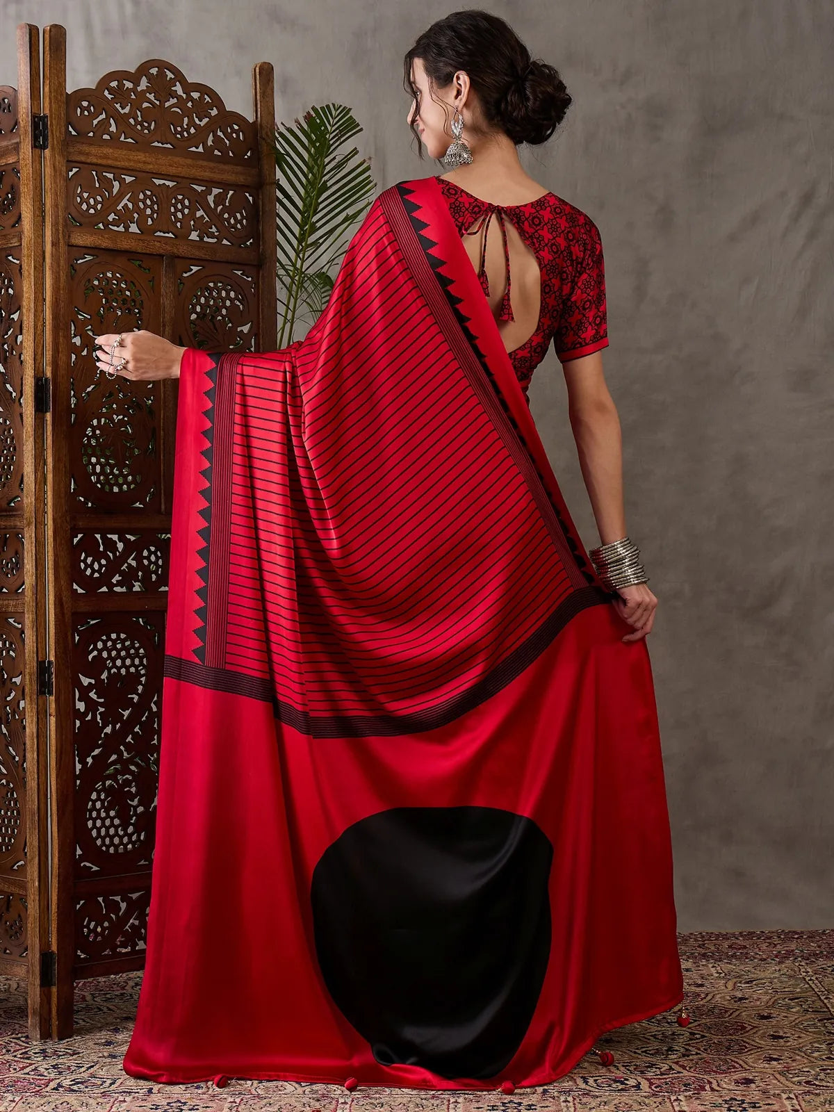 Tarani red semi modal satin saree back view featuring blouse back pattern and pallu