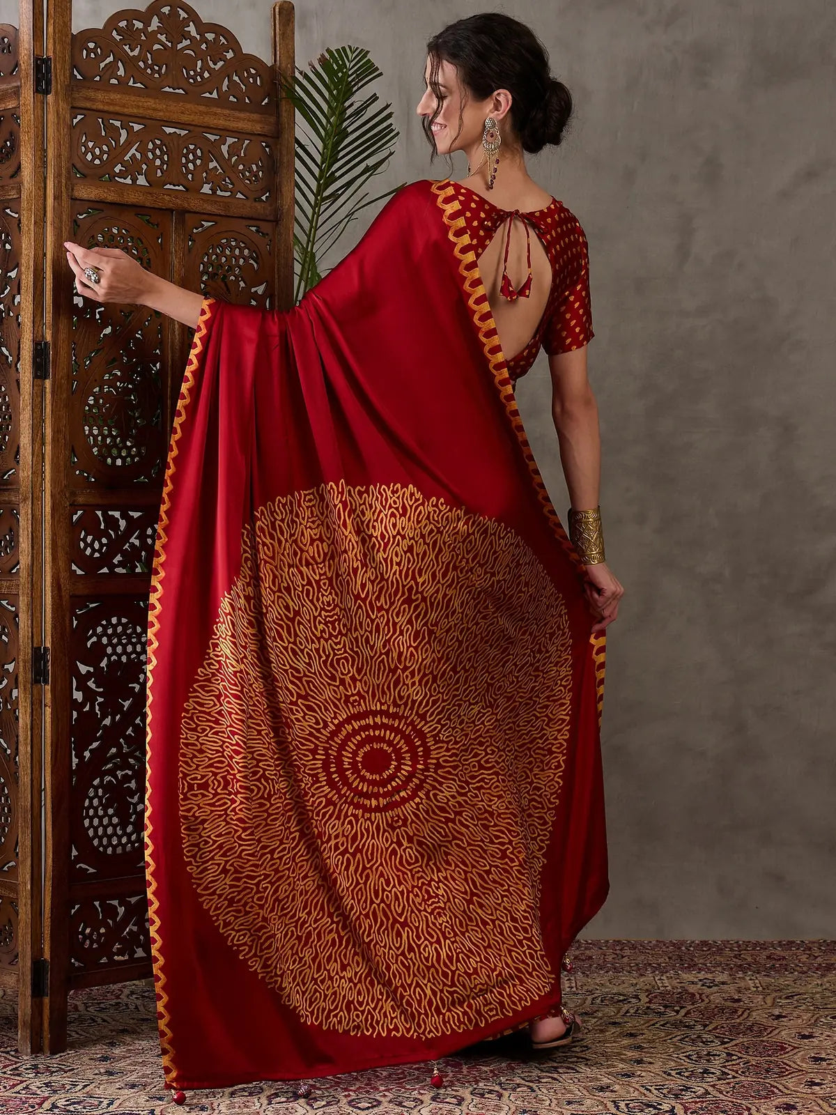 Tarani red semi modal satin saree back view with printed pallu artwork