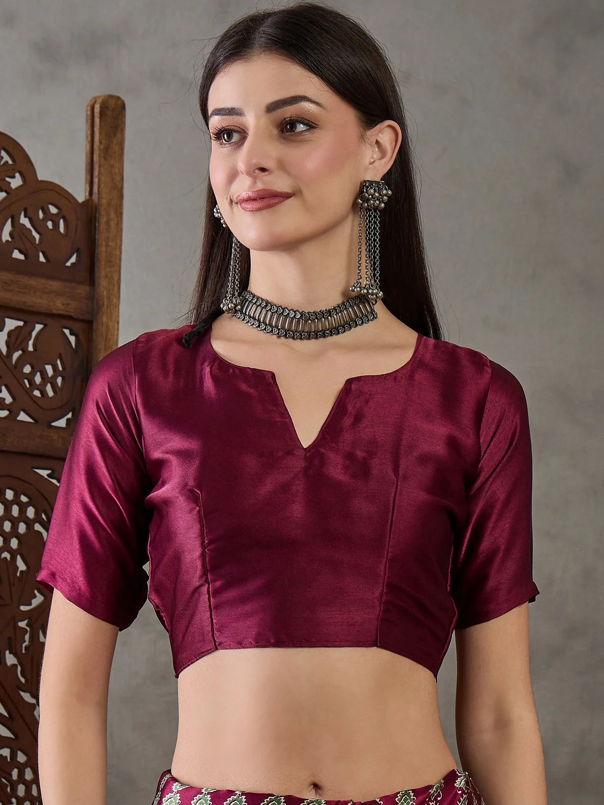 Tarani Aruna maroon blouse close up view with red printed saree styling