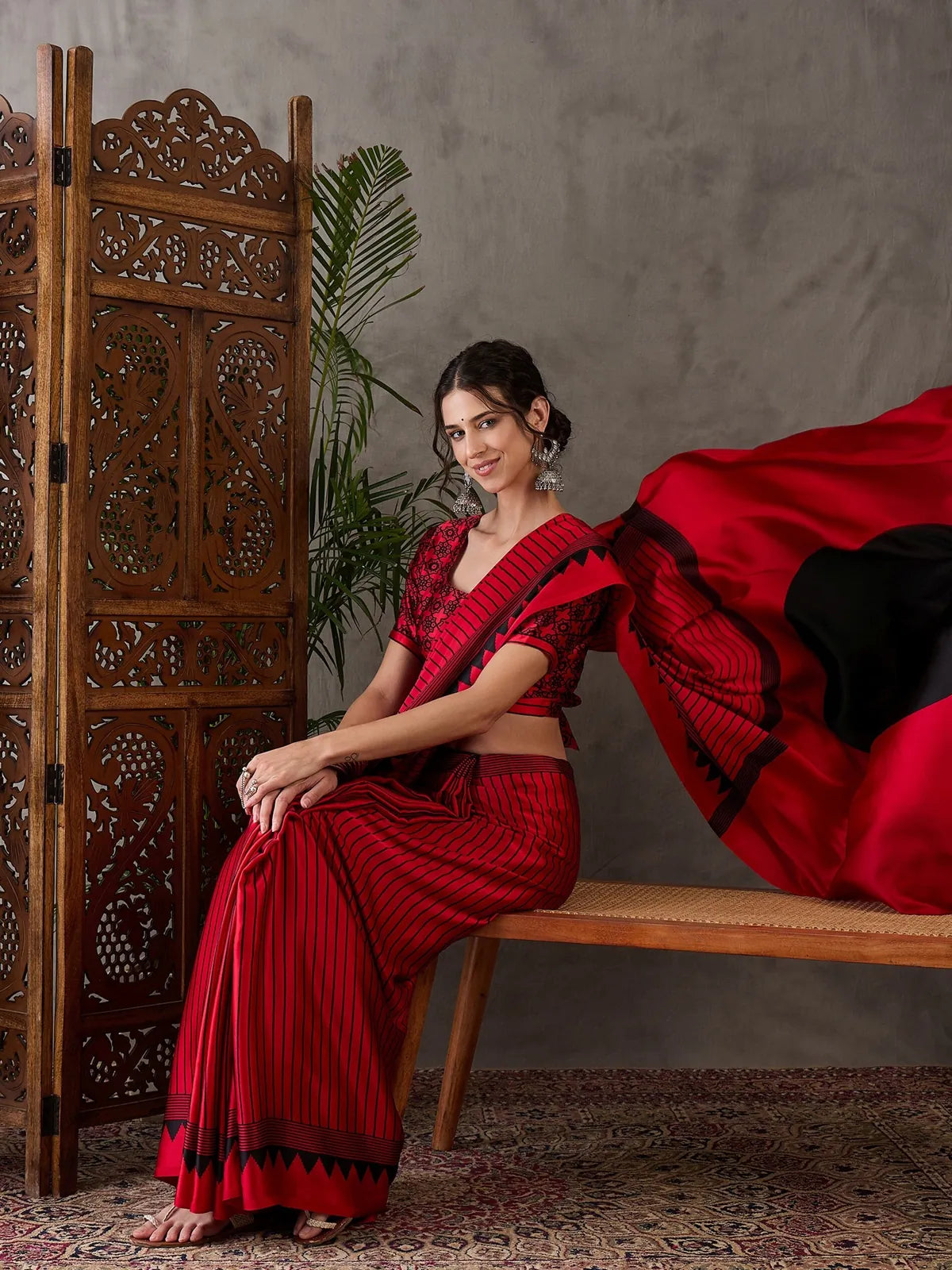 Tarani red printed semi modal satin saree pallu view with bold contrast design
