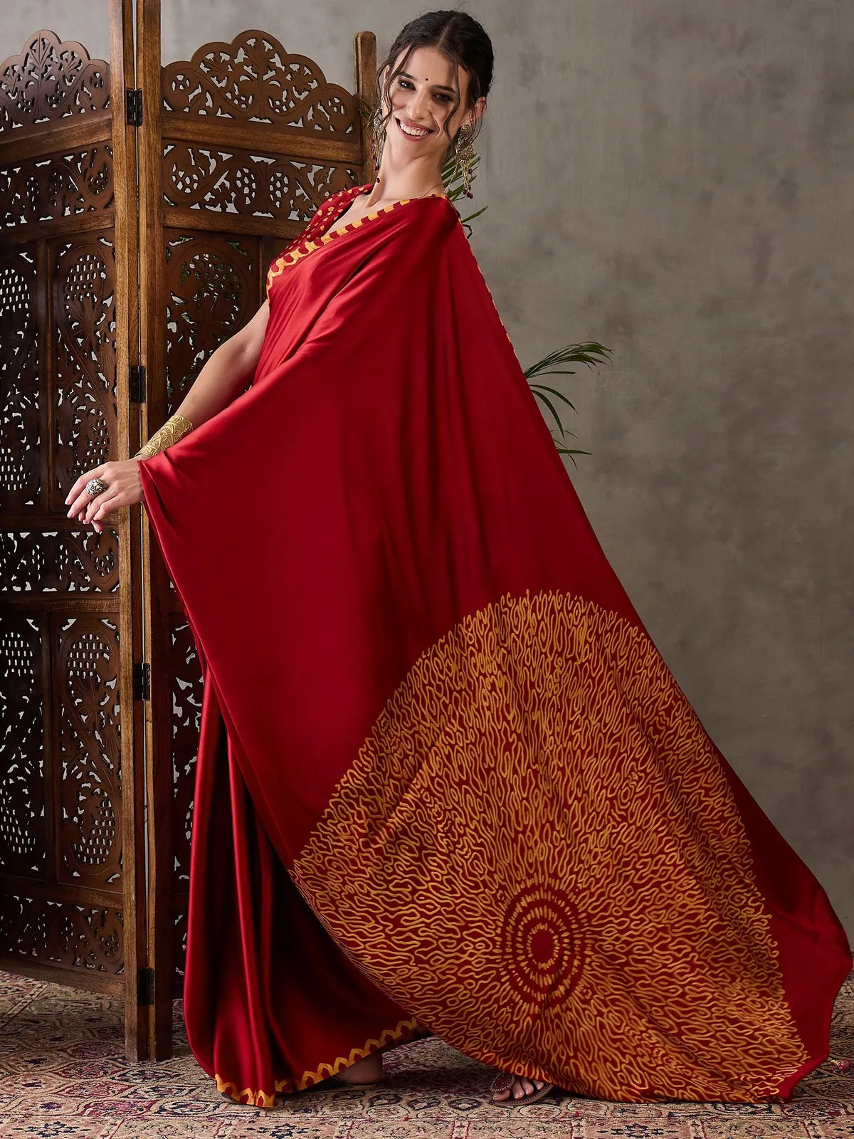 Tarani red semi modal satin saree showcasing artistic printed pallu design