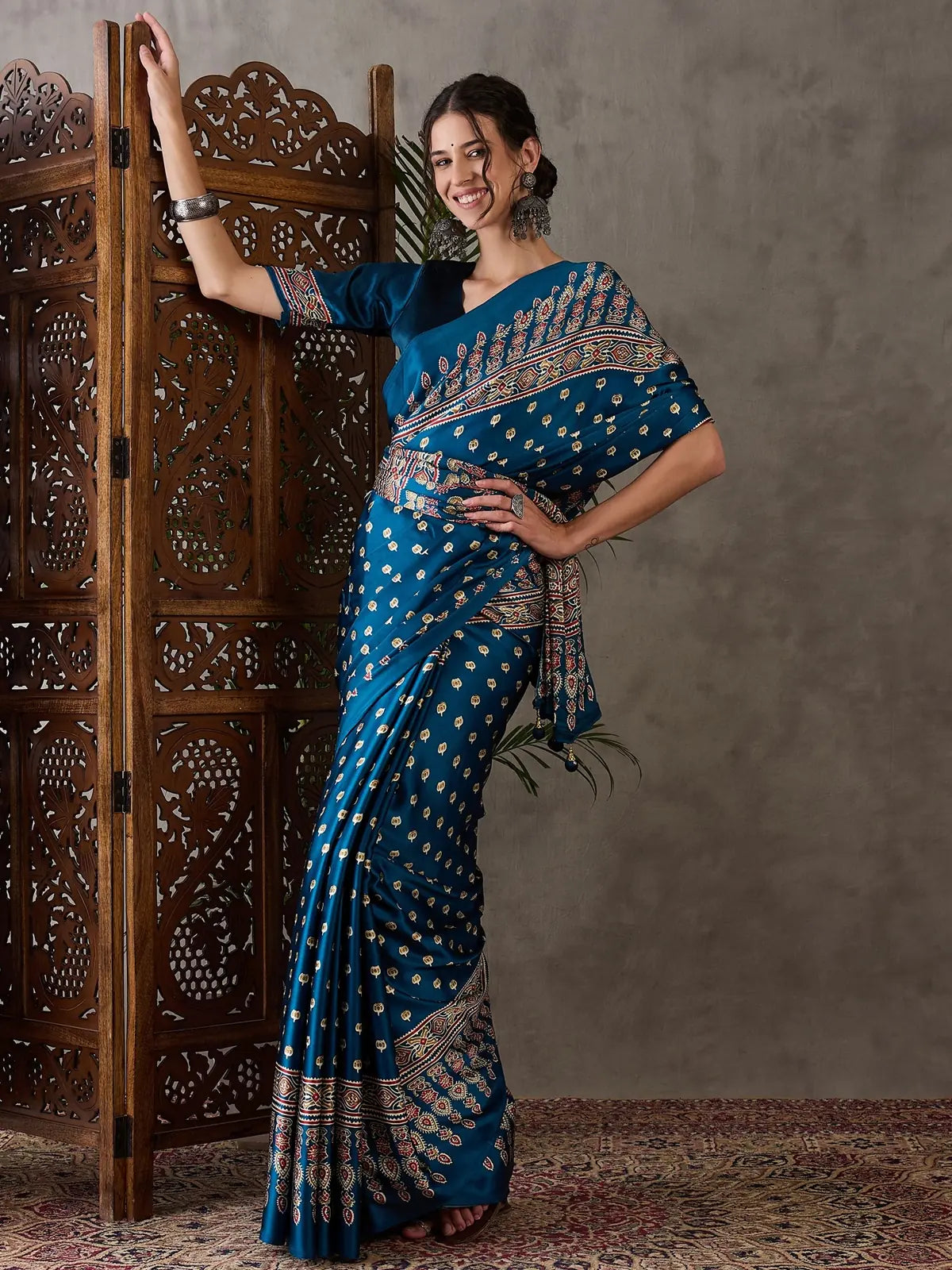 Tarani Namrata festival wear teal saree front pose with printed motifs