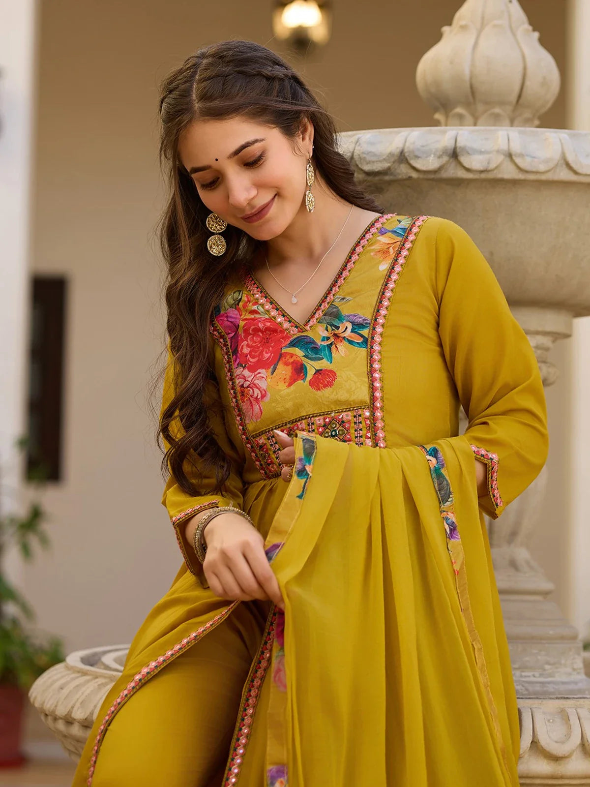 Tarani green silk dress close-up showing embroidery and printed dupatta