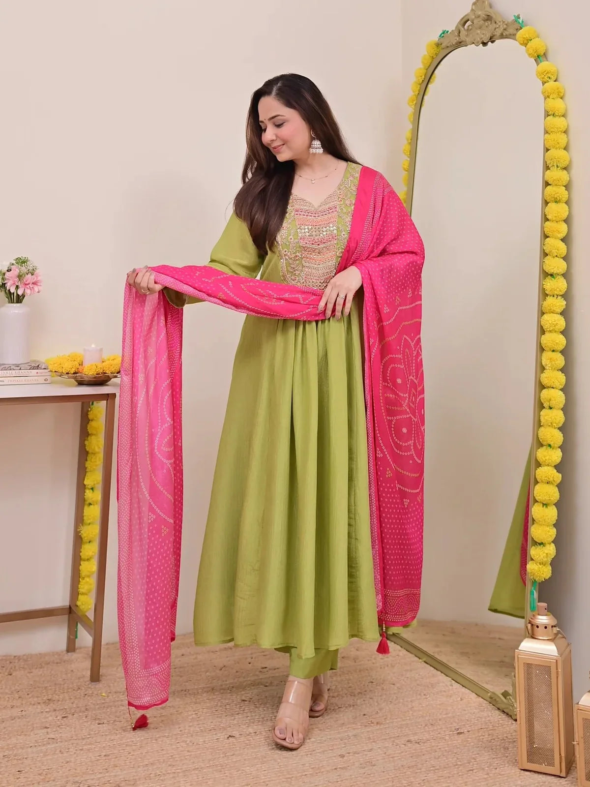 Tarani front-facing silk festive dress in green with bright pink dupatta styling