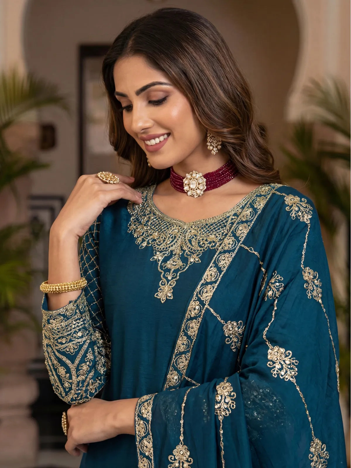 Tarani premium green dress upper body close-up showing neckline embroidery and sleeve details