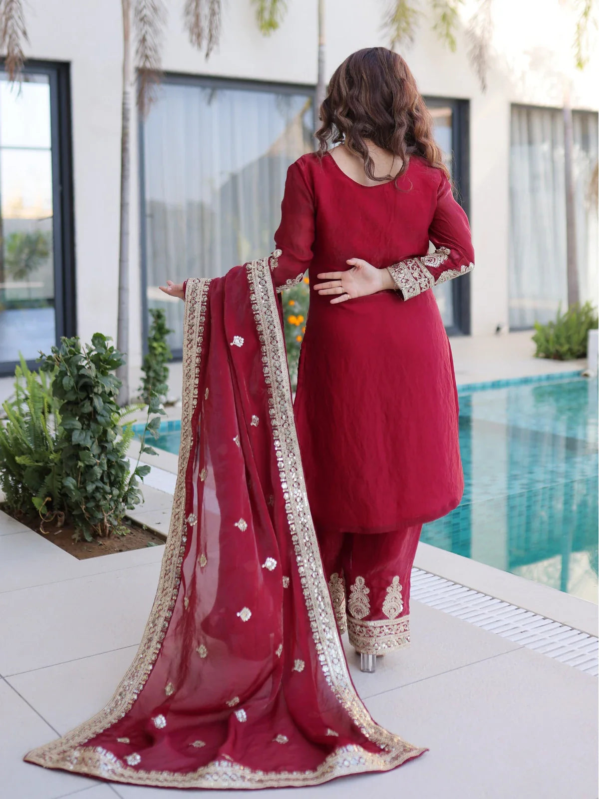 Tarani maroon silk dress back view showing dupatta lace and full flare